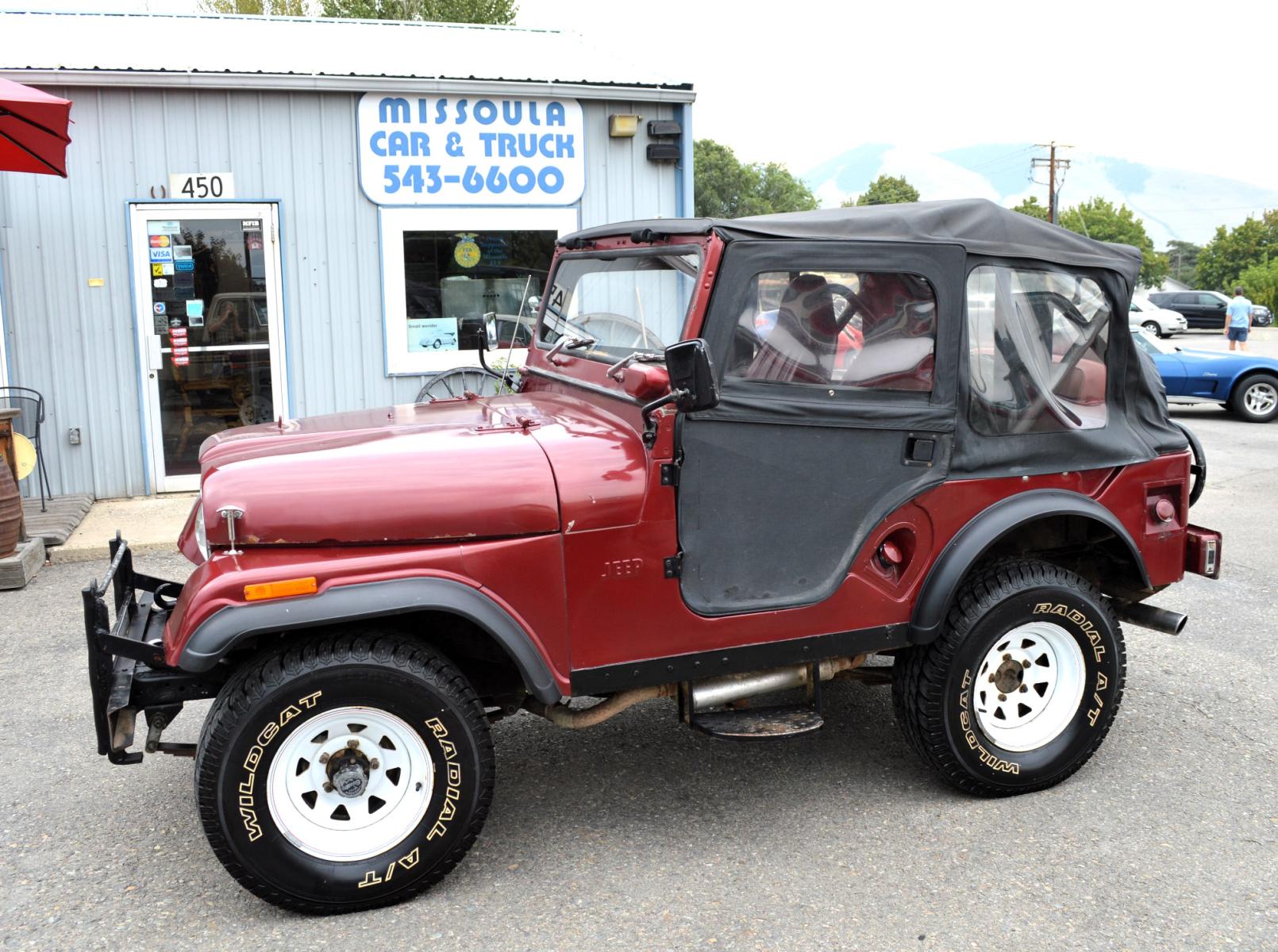 1969 Maroon Jeep CJ5 (83050173554) with an 235 6 Cylinder engine, 3 Speed Manual transmission, located at 450 N Russell, Missoula, MT, 59801, (406) 543-6600, 46.874496, -114.017433 - Cute little Jeep. 4 Wheel drive Works Great. 3 Speed Manual Transmission. Rear Bench Seat. Comes with Soft Top. No Hard Top. Does come with a Nice cover as well. This vehicle is more then 20 years old and is not eligible for lending through our finance companies. - Photo #0