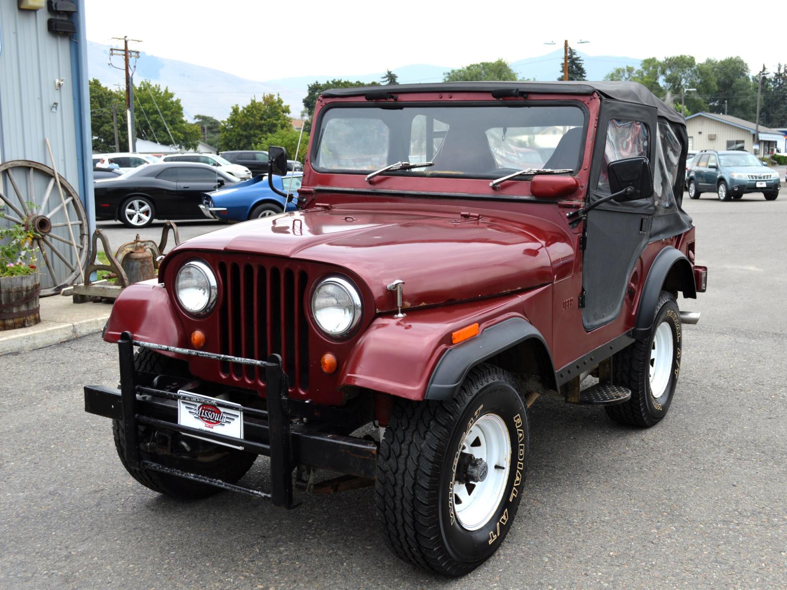 1969 Maroon Jeep CJ5 (83050173554) with an 235 6 Cylinder engine, 3 Speed Manual transmission, located at 450 N Russell, Missoula, MT, 59801, (406) 543-6600, 46.874496, -114.017433 - Cute little Jeep. 4 Wheel drive Works Great. 3 Speed Manual Transmission. Rear Bench Seat. Comes with Soft Top. No Hard Top. Does come with a Nice cover as well. This vehicle is more then 20 years old and is not eligible for lending through our finance companies. - Photo #1