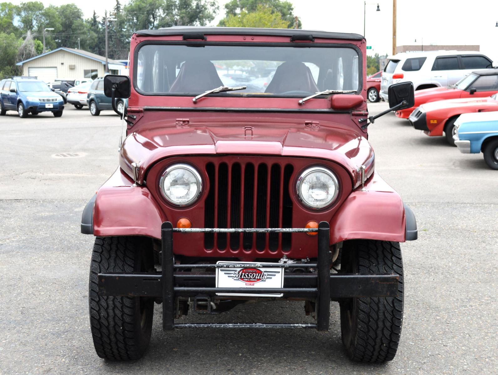 1969 Maroon Jeep CJ5 (83050173554) with an 235 6 Cylinder engine, 3 Speed Manual transmission, located at 450 N Russell, Missoula, MT, 59801, (406) 543-6600, 46.874496, -114.017433 - Cute little Jeep. 4 Wheel drive Works Great. 3 Speed Manual Transmission. Rear Bench Seat. Comes with Soft Top. No Hard Top. Does come with a Nice cover as well. This vehicle is more then 20 years old and is not eligible for lending through our finance companies. - Photo #2