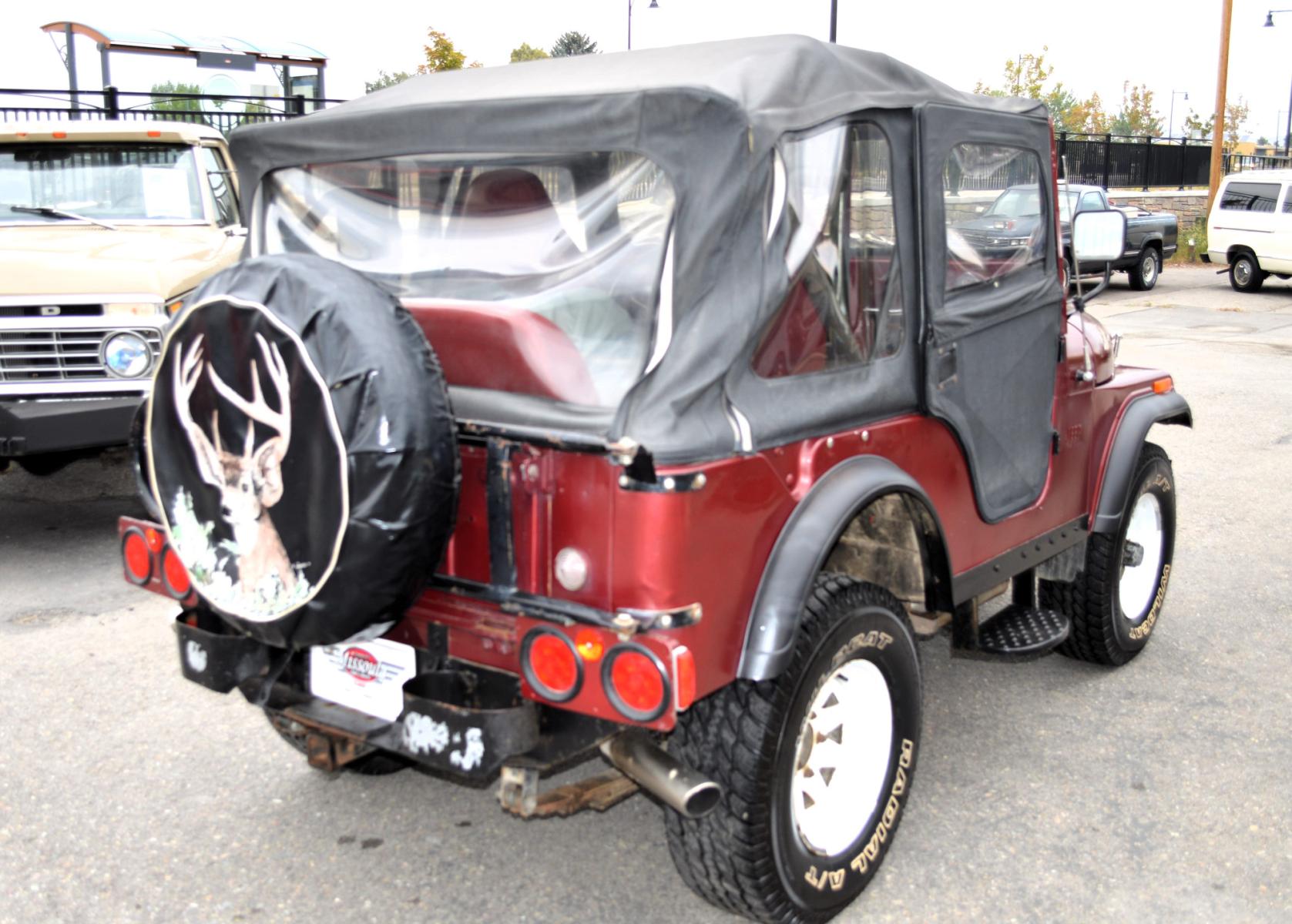 1969 Maroon Jeep CJ5 (83050173554) with an 235 6 Cylinder engine, 3 Speed Manual transmission, located at 450 N Russell, Missoula, MT, 59801, (406) 543-6600, 46.874496, -114.017433 - Cute little Jeep. 4 Wheel drive Works Great. 3 Speed Manual Transmission. Rear Bench Seat. Comes with Soft Top. No Hard Top. Does come with a Nice cover as well. This vehicle is more then 20 years old and is not eligible for lending through our finance companies. - Photo #6