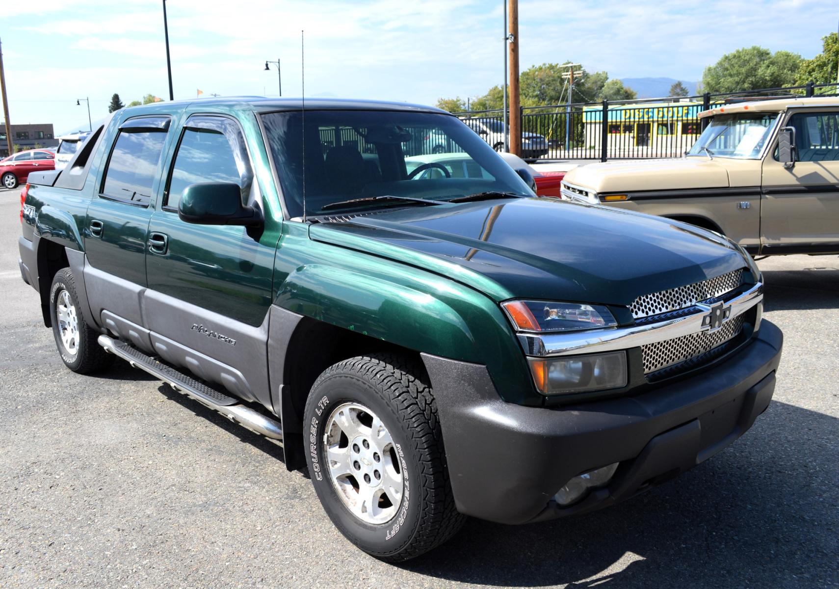 2003 Green Chevrolet Avalanche 1500 4WD (3GNEK13T83G) with an 5.3L V8 OHV 16V engine, 4-Speed Automatic Overdrive transmission, located at 450 N Russell, Missoula, MT, 59801, (406) 543-6600, 46.874496, -114.017433 - Barely over 100K Miles. Runs well. Good condition overall. Automatic Transmission. Air. Cruise. Tilt. AM FM CD Player. This vehicle is more then 20 years old and is not eligible for lending through our finance companies. - Photo #2