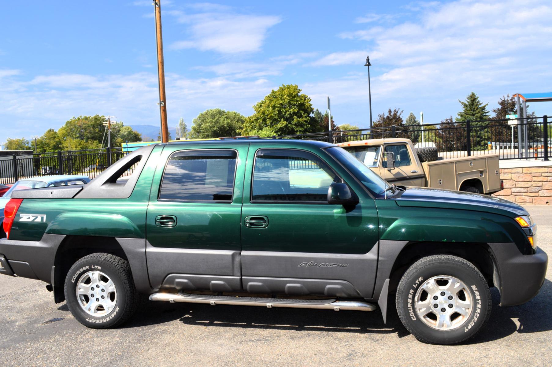 2003 Green Chevrolet Avalanche 1500 4WD (3GNEK13T83G) with an 5.3L V8 OHV 16V engine, 4-Speed Automatic Overdrive transmission, located at 450 N Russell, Missoula, MT, 59801, (406) 543-6600, 46.874496, -114.017433 - Barely over 100K Miles. Runs well. Good condition overall. Automatic Transmission. Air. Cruise. Tilt. AM FM CD Player. This vehicle is more then 20 years old and is not eligible for lending through our finance companies. - Photo #3