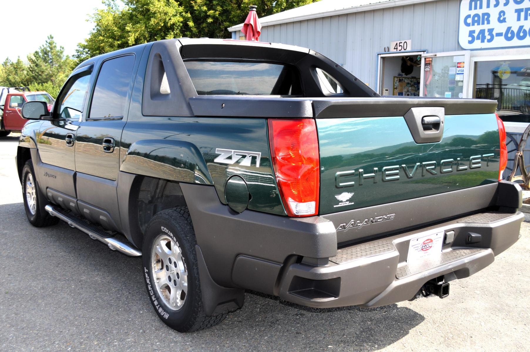 2003 Green Chevrolet Avalanche 1500 4WD (3GNEK13T83G) with an 5.3L V8 OHV 16V engine, 4-Speed Automatic Overdrive transmission, located at 450 N Russell, Missoula, MT, 59801, (406) 543-6600, 46.874496, -114.017433 - Barely over 100K Miles. Runs well. Good condition overall. Automatic Transmission. Air. Cruise. Tilt. AM FM CD Player. This vehicle is more then 20 years old and is not eligible for lending through our finance companies. - Photo #6