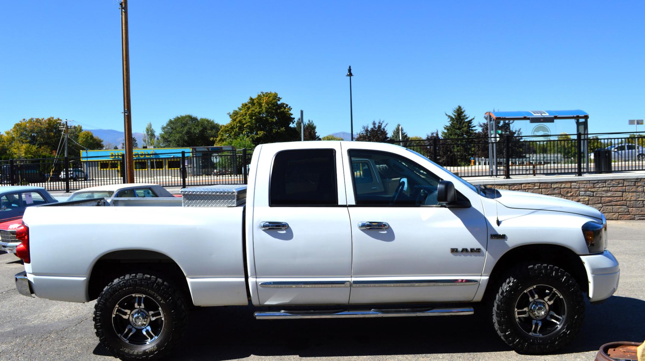 2008 White Dodge Ram 1500 Laramie Quad Cab 4WD (1D7HU18208S) with an 5.7L V8 OHV 16V engine, 5-Speed Automatic Overdrive transmission, located at 450 N Russell, Missoula, MT, 59801, (406) 543-6600, 46.874496, -114.017433 - Clean Truck with Nice Wheels and Tires. 5 Speed Automatic Transmission. Power Sunroof. Heated Power Seats. Premium sound. 6 CD Changer. Air. Cruise. Tilt. Power Windows and Locks. Running Boards.Towing. Tool Box. - Photo #4