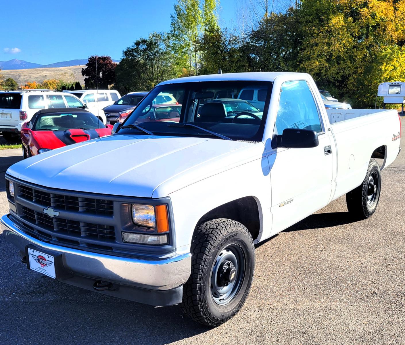 1998 White Chevrolet C/K 1500 Reg. Cab 8-ft. Bed 4WD (1GCEK14R5WZ) with an 5.7L V8 OHV 16V engine, Automatic transmission, located at 450 N Russell, Missoula, MT, 59801, (406) 543-6600, 46.874496, -114.017433 - Nice 4 Wheel Drive Chevy. Runs Amazing. Automatic Transmission. Air. Cruise. Tilt. AM FM Cassette. Good Hankook Tires. This vehicle is more then 20 years old and is not eligible for lending through our finance companies. - Photo #9