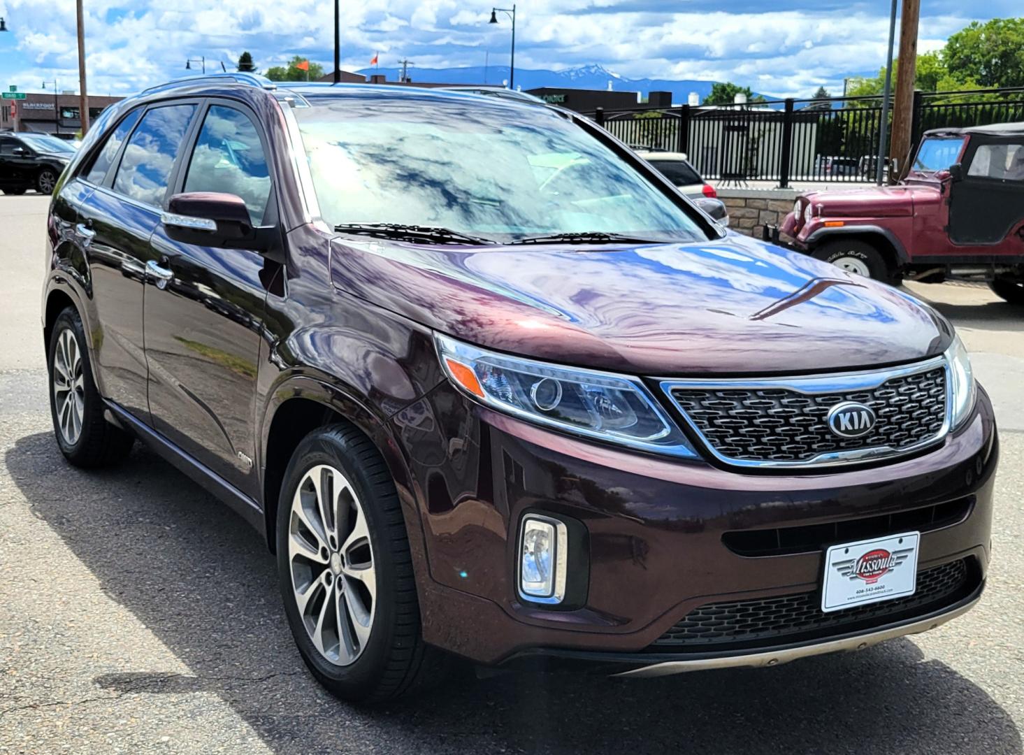 2014 Maroon /Black Kia Sorento SX (5XYKWDA7XEG) with an 3.3L V6 engine, 6 Speed Auto transmission, located at 450 N Russell, Missoula, MT, 59801, (406) 543-6600, 46.874496, -114.017433 - Beautiful AWD SUV. 3.3L V6 Engine. 6 Speed Automatic Transmission. Power Sunroof. Heated Leather Power Seats. Navigation. 3rd Row Seating. Bluetooth. Backup Camera. Front and Rear Climate Control. Power Rear Gate. Clean Carfax. - Photo#3