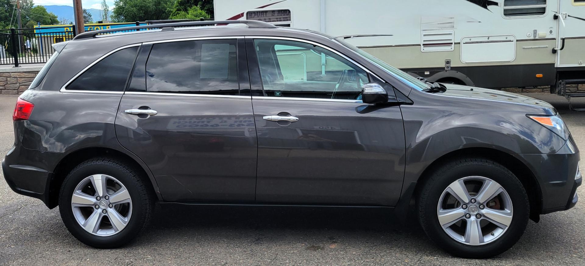 2012 Grey /Black Acura MDX Tech Package (2HNYD2H35CH) with an 3.7L V6 engine, 6 Speed Auto transmission, located at 450 N Russell, Missoula, MT, 59801, (406) 543-6600, 46.874496, -114.017433 - All Wheel Drive Acura MDX. 3.7 V6 Engine. 6 Speed Automatic Transmission. Heated Leather Seats. Power Sunroof. 3rd Row Seating. Bluetooth. Backup Camera. AM FM XM CD P,layer. Navigation. Front and Rear Air Conditioning. Power Windows and Locks. NEW TIRES! - Photo#5