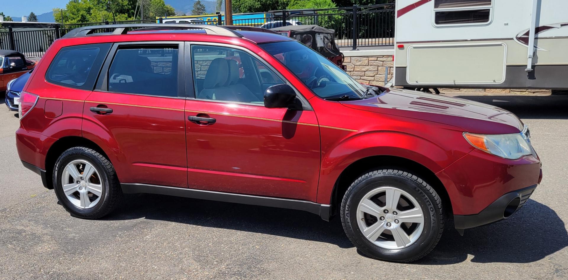 2012 Red /White Subaru Forester 2.5X (JF2SHABC3CH) with an 2.5L H4 engine, 4 Speed Auto transmission, located at 450 N Russell, Missoula, MT, 59801, (406) 543-6600, 46.874496, -114.017433 - Very Clean 2 Owner Forester. Good Carfax. 2.5L H4 Engine. Only 67K Miles. 4 Speed Automatic Transmission. AWD. Air Cruise. Tilt. Newer Uniroyal Tires. AM FM CD Player. - Photo#4