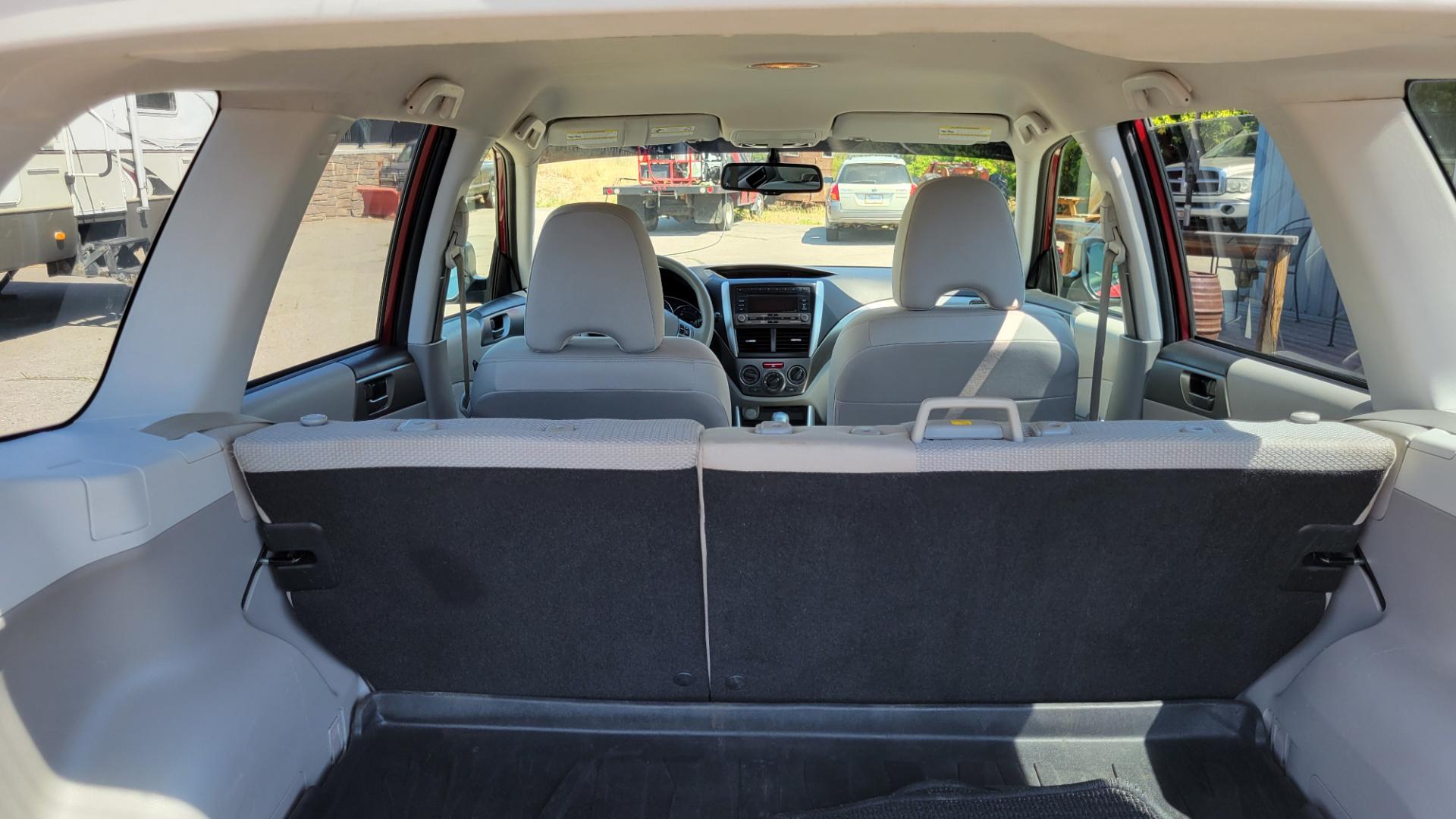 2012 Red /White Subaru Forester 2.5X (JF2SHABC3CH) with an 2.5L H4 engine, 4 Speed Auto transmission, located at 450 N Russell, Missoula, MT, 59801, (406) 543-6600, 46.874496, -114.017433 - Very Clean 2 Owner Forester. Good Carfax. 2.5L H4 Engine. Only 67K Miles. 4 Speed Automatic Transmission. AWD. Air Cruise. Tilt. Newer Uniroyal Tires. AM FM CD Player. - Photo#8