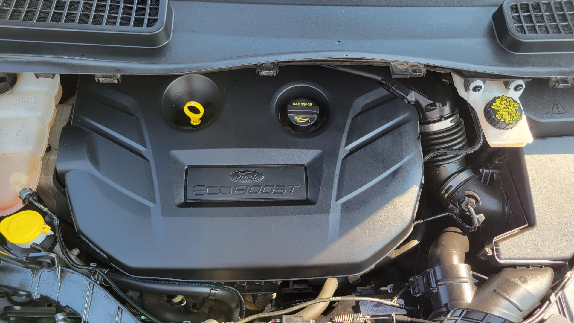 2016 Grey /Black Ford Escape Titanium 4WD (1FMCU9J91GU) with an 2.0L L4 engine, 6 Speed Auto transmission, located at 450 N Russell, Missoula, MT, 59801, (406) 543-6600, 46.874496, -114.017433 - Nice Little 4WD SUV. 2.0L L4 Engine. 6 Speed Automatic Transmission. Heated Seats. Power Lift Gate. Bluetooth. Backup Camera. Touch Screen. AM FM CD. Power Drivers Seat. Fog Lights. Roof Rack Rails. Remote Start. Weather Tech Floor Liners. - Photo#17