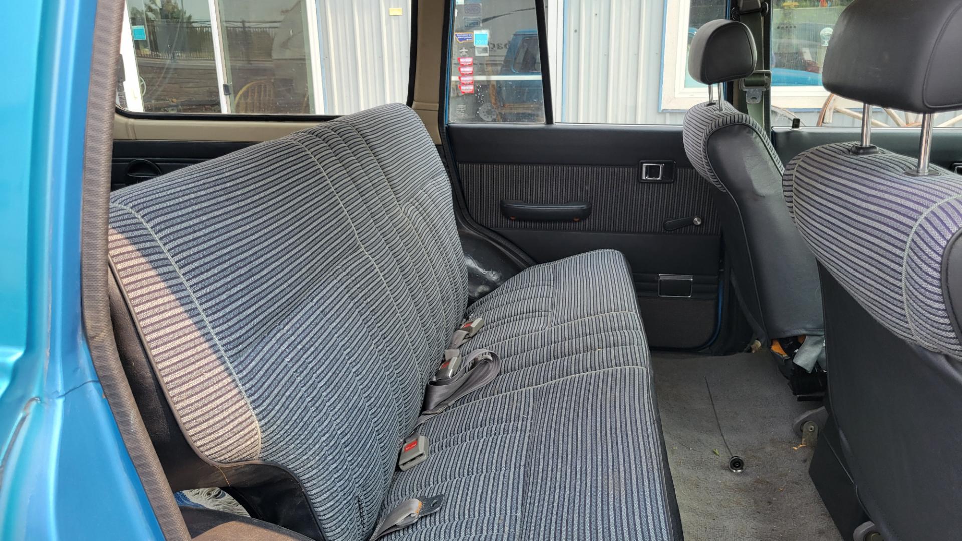 1984 Blue /Tan Toyota Land Cruiser FJ60 (JT3FJ60G3E1) with an 4.2L L6 engine, 4 Speed Manual transmission, located at 450 N Russell, Missoula, MT, 59801, (406) 543-6600, 46.874496, -114.017433 - Hard to find FJ. 4.2 Straight 6 Engine. 4 Speed Manual Transmission. Shows a little rust which i s common for this year of Land Cruiser. factory a/c pretty much an unmolested original still has smog pump original interior etc Current owner purchased in Bozeman in 1999 Because of the ag - Photo#10