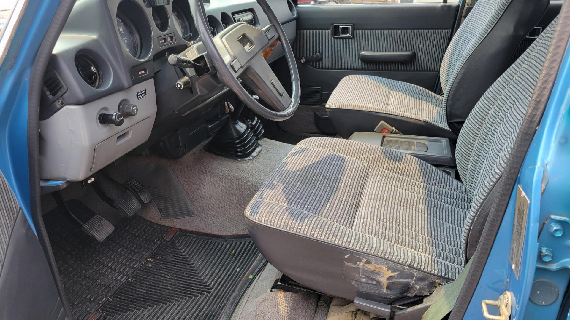 1984 Blue /Tan Toyota Land Cruiser FJ60 (JT3FJ60G3E1) with an 4.2L L6 engine, 4 Speed Manual transmission, located at 450 N Russell, Missoula, MT, 59801, (406) 543-6600, 46.874496, -114.017433 - Hard to find FJ. 4.2 Straight 6 Engine. 4 Speed Manual Transmission. Shows a little rust which i s common for this year of Land Cruiser. factory a/c pretty much an unmolested original still has smog pump original interior etc Current owner purchased in Bozeman in 1999 Because of the ag - Photo#13