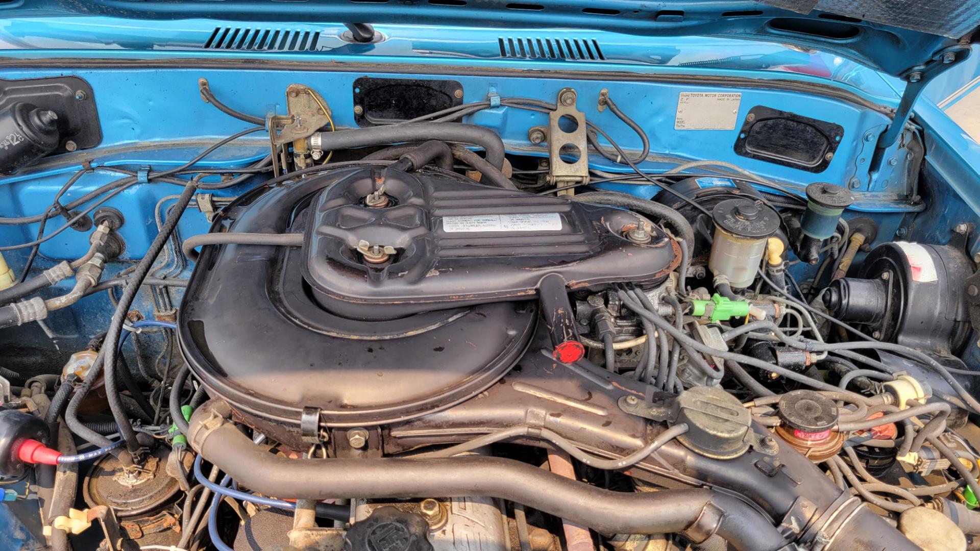 1984 Blue /Tan Toyota Land Cruiser FJ60 (JT3FJ60G3E1) with an 4.2L L6 engine, 4 Speed Manual transmission, located at 450 N Russell, Missoula, MT, 59801, (406) 543-6600, 46.874496, -114.017433 - Hard to find FJ. 4.2 Straight 6 Engine. 4 Speed Manual Transmission. Shows a little rust which i s common for this year of Land Cruiser. factory a/c pretty much an unmolested original still has smog pump original interior etc Current owner purchased in Bozeman in 1999 Because of the ag - Photo#17