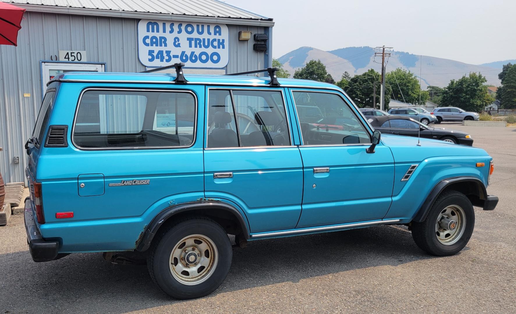 1984 Blue /Tan Toyota Land Cruiser FJ60 (JT3FJ60G3E1) with an 4.2L L6 engine, 4 Speed Manual transmission, located at 450 N Russell, Missoula, MT, 59801, (406) 543-6600, 46.874496, -114.017433 - Hard to find FJ. 4.2 Straight 6 Engine. 4 Speed Manual Transmission. Shows a little rust which i s common for this year of Land Cruiser. factory a/c pretty much an unmolested original still has smog pump original interior etc Current owner purchased in Bozeman in 1999 Because of the ag - Photo#7