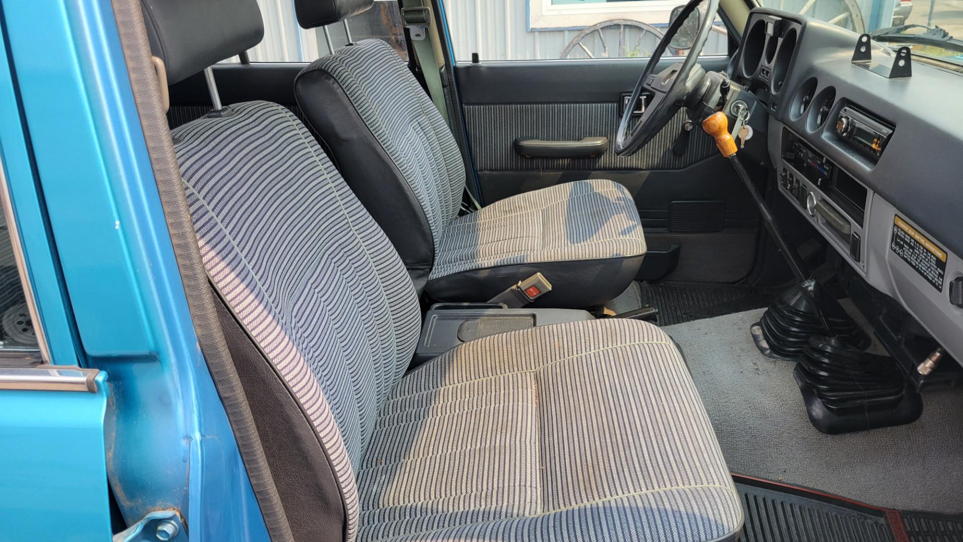 1984 Blue /Tan Toyota Land Cruiser FJ60 (JT3FJ60G3E1) with an 4.2L L6 engine, 4 Speed Manual transmission, located at 450 N Russell, Missoula, MT, 59801, (406) 543-6600, 46.874496, -114.017433 - Hard to find FJ. 4.2 Straight 6 Engine. 4 Speed Manual Transmission. Shows a little rust which i s common for this year of Land Cruiser. factory a/c pretty much an unmolested original still has smog pump original interior etc Current owner purchased in Bozeman in 1999 Because of the ag - Photo#8