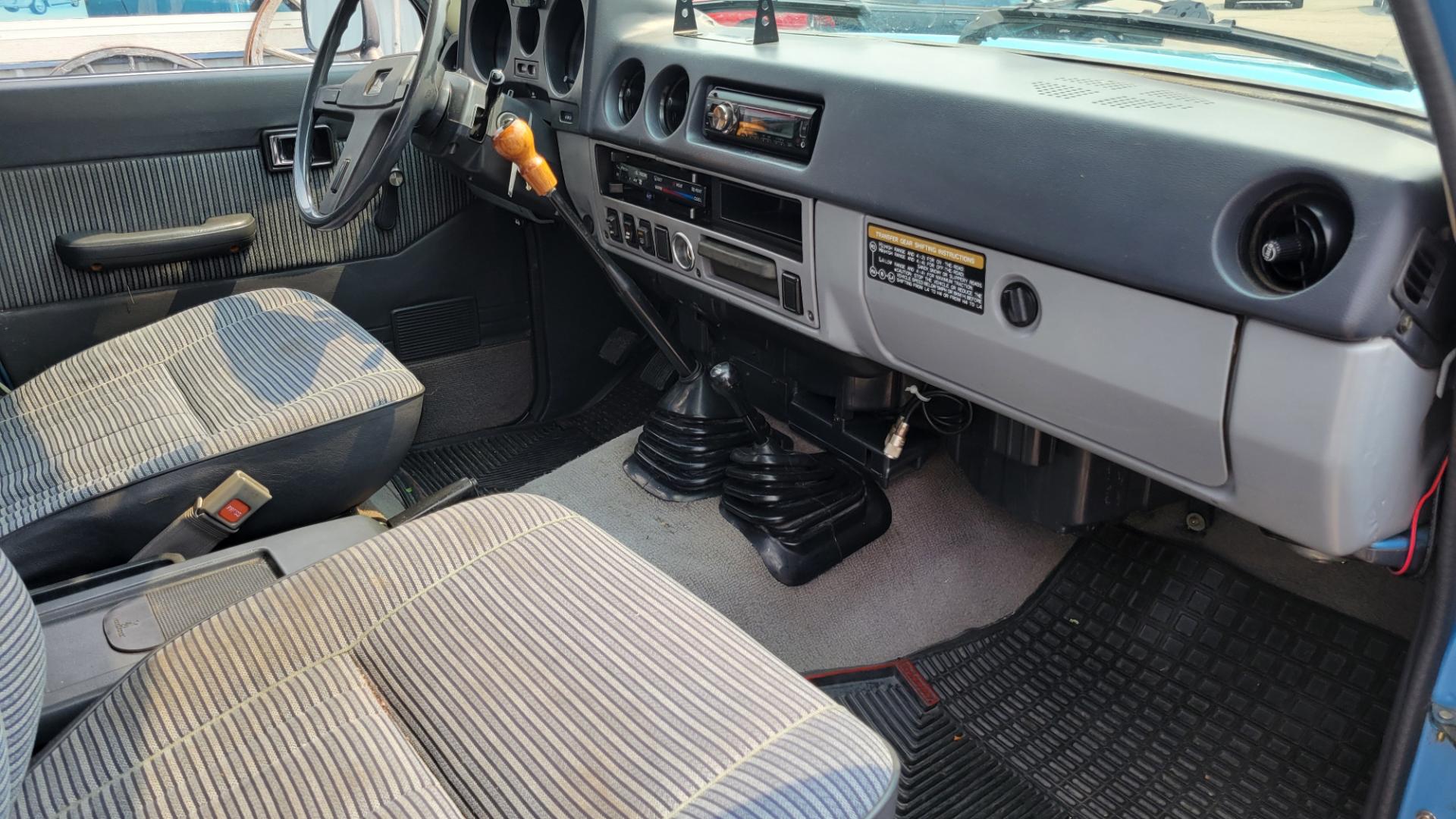 1984 Blue /Tan Toyota Land Cruiser FJ60 (JT3FJ60G3E1) with an 4.2L L6 engine, 4 Speed Manual transmission, located at 450 N Russell, Missoula, MT, 59801, (406) 543-6600, 46.874496, -114.017433 - Hard to find FJ. 4.2 Straight 6 Engine. 4 Speed Manual Transmission. Shows a little rust which i s common for this year of Land Cruiser. factory a/c pretty much an unmolested original still has smog pump original interior etc Current owner purchased in Bozeman in 1999 Because of the ag - Photo#9
