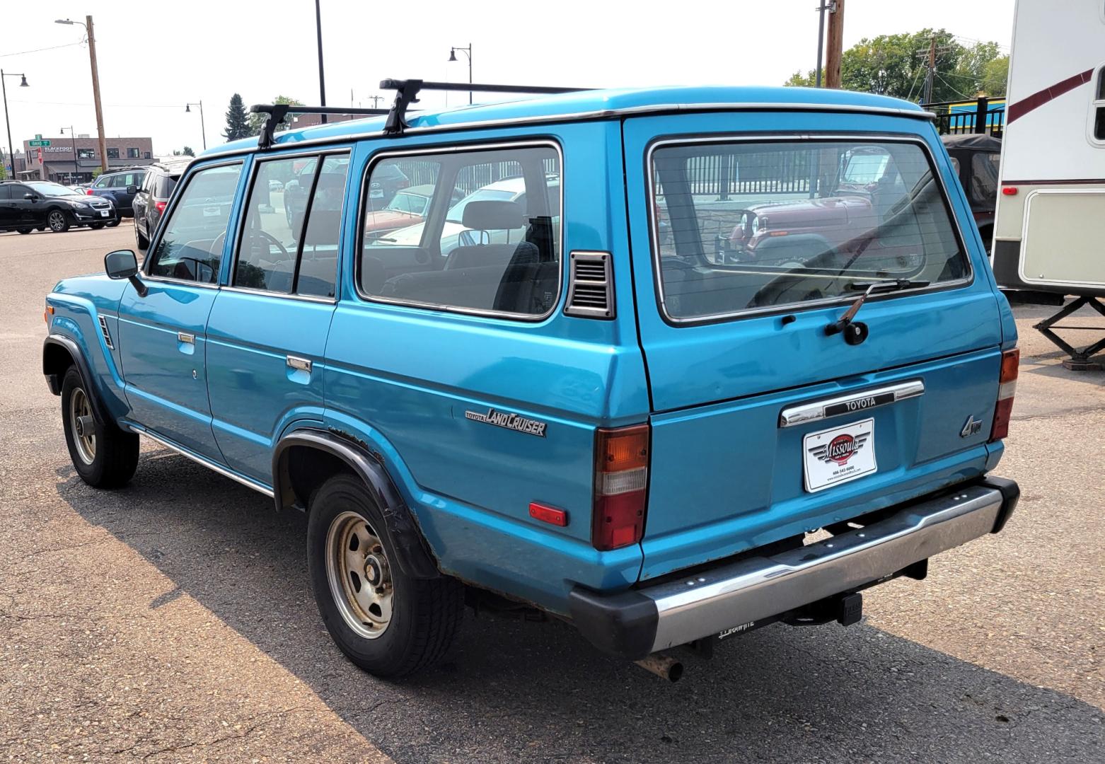 1984 Blue /Tan Toyota Land Cruiser FJ60 (JT3FJ60G3E1) with an 4.2L L6 engine, 4 Speed Manual transmission, located at 450 N Russell, Missoula, MT, 59801, (406) 543-6600, 46.874496, -114.017433 - Hard to find FJ. 4.2 Straight 6 Engine. 4 Speed Manual Transmission. Shows a little rust which i s common for this year of Land Cruiser. factory a/c pretty much an unmolested original still has smog pump original interior etc Current owner purchased in Bozeman in 1999 Because of the ag - Photo#4