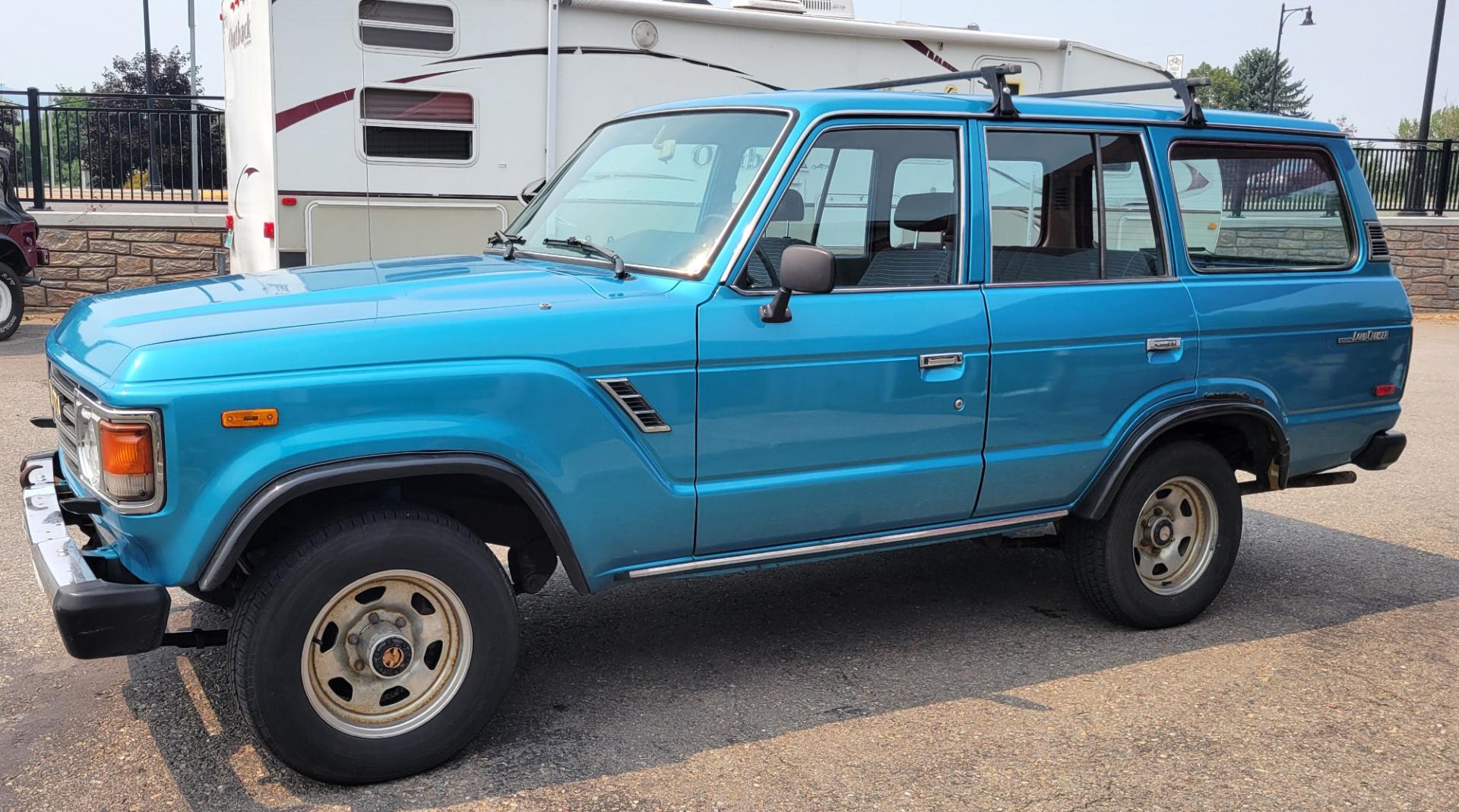 1984 Blue /Tan Toyota Land Cruiser FJ60 (JT3FJ60G3E1) with an 4.2L L6 engine, 4 Speed Manual transmission, located at 450 N Russell, Missoula, MT, 59801, (406) 543-6600, 46.874496, -114.017433 - Hard to find FJ. 4.2 Straight 6 Engine. 4 Speed Manual Transmission. Shows a little rust which i s common for this year of Land Cruiser. factory a/c pretty much an unmolested original still has smog pump original interior etc Current owner purchased in Bozeman in 1999 Because of the ag - Photo#3