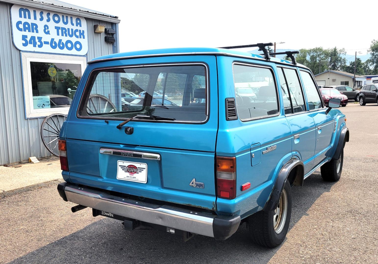 1984 Blue /Tan Toyota Land Cruiser FJ60 (JT3FJ60G3E1) with an 4.2L L6 engine, 4 Speed Manual transmission, located at 450 N Russell, Missoula, MT, 59801, (406) 543-6600, 46.874496, -114.017433 - Hard to find FJ. 4.2 Straight 6 Engine. 4 Speed Manual Transmission. Shows a little rust which i s common for this year of Land Cruiser. factory a/c pretty much an unmolested original still has smog pump original interior etc Current owner purchased in Bozeman in 1999 Because of the ag - Photo#6
