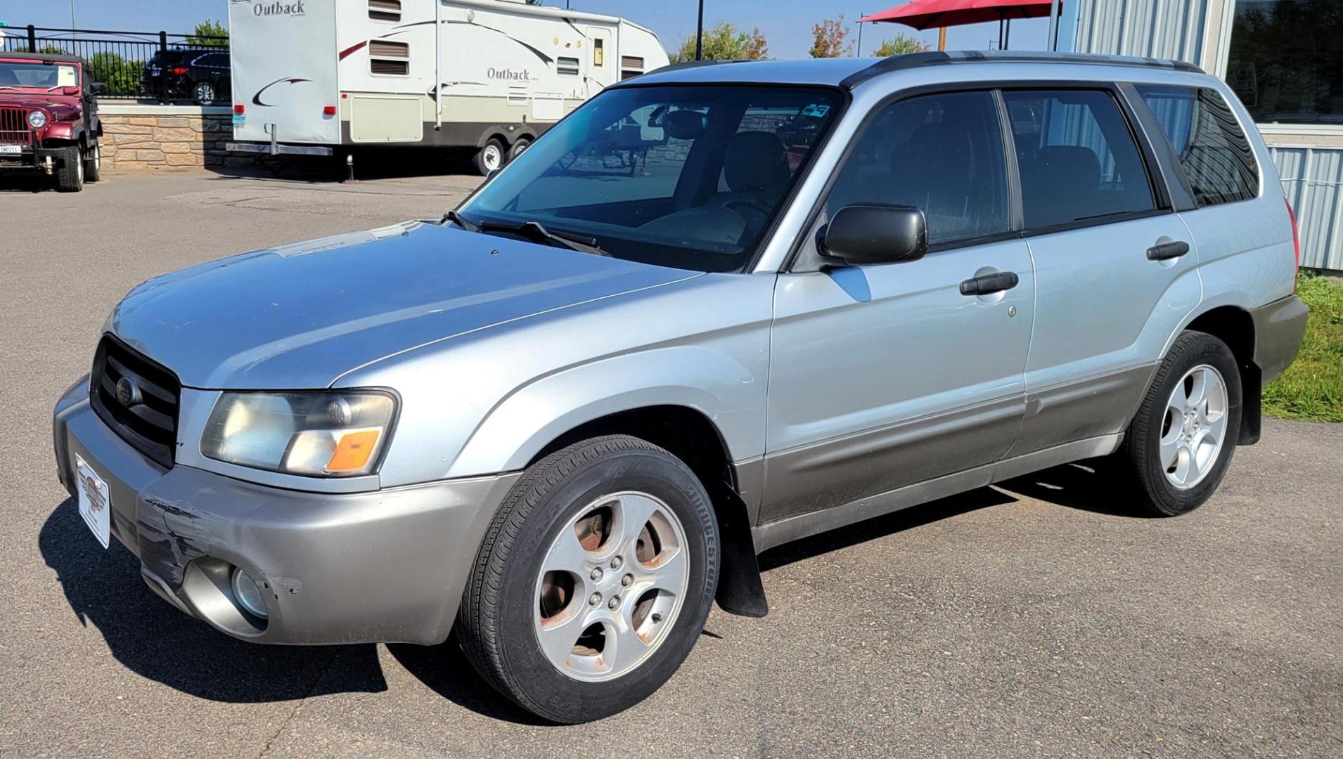 2003 Silver /Gray Subaru Forester 2.5 XS (JF1SG65633H) with an 2.5L H4 SOHC 16V engine, 4-Speed Automatic Overdrive transmission, located at 450 N Russell, Missoula, MT, 59801, (406) 543-6600, 46.874496, -114.017433 - 2.5L I4 Engine. AWD. Automatic Transmission. Air Blows Cold. The engine seems a little tired so we are selling as an around town vehicle or for parts as most of the body is very good and the transmission seems strong. Starts every time. Financing is not available. - Photo#1