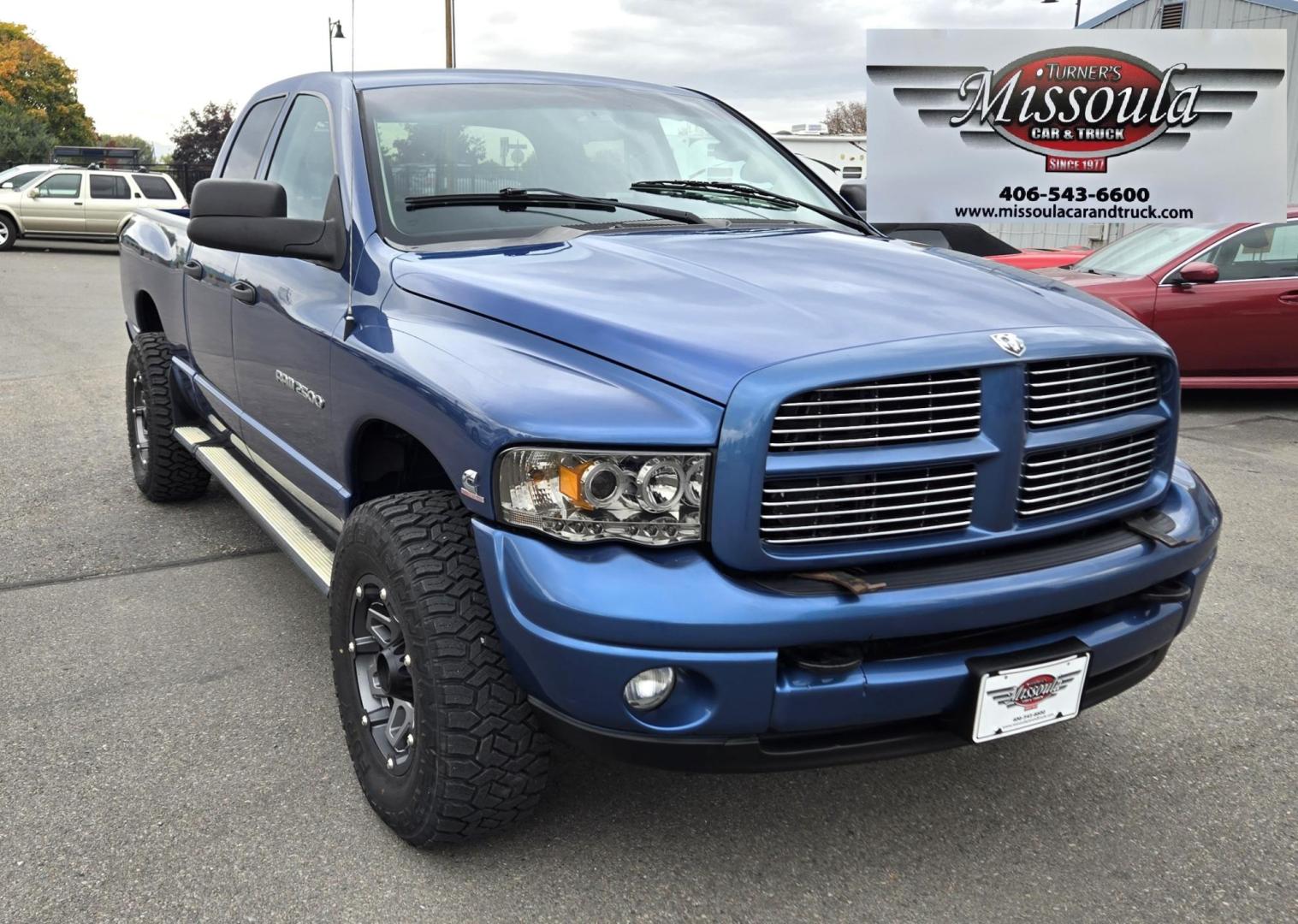 2003 Blue /Black Dodge Ram 2500 Laramie Quad Cab Long Bed 4WD (3D7KU28C13G) with an 5.9L L6 OHV 24V TURBO DIESEL engine, 6 Speed Manual transmission, located at 450 N Russell, Missoula, MT, 59801, (406) 543-6600, 46.874496, -114.017433 - Very Nice 5.9 Diesel 4WD Pickup. Hard to find 6 Speed Manual Transmission. Great Miles for it's age. Air Cruise. Tilt. Power Windows and Locks. Power Drivers Seat. Running Boards. Nice Tires and Wheels. Towing. Because of the age of this vehicle, financing is NOT available. - Photo#2