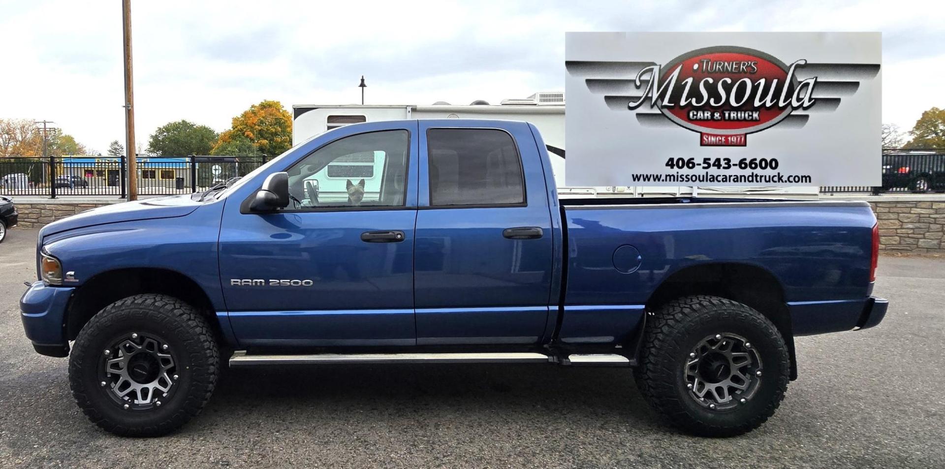 2003 Blue /Black Dodge Ram 2500 Laramie Quad Cab Long Bed 4WD (3D7KU28C13G) with an 5.9L L6 OHV 24V TURBO DIESEL engine, 6 Speed Manual transmission, located at 450 N Russell, Missoula, MT, 59801, (406) 543-6600, 46.874496, -114.017433 - Very Nice 5.9 Diesel 4WD Pickup. Hard to find 6 Speed Manual Transmission. Great Miles for it's age. Air Cruise. Tilt. Power Windows and Locks. Power Drivers Seat. Running Boards. Nice Tires and Wheels. Towing. Because of the age of this vehicle, financing is NOT available. - Photo#0