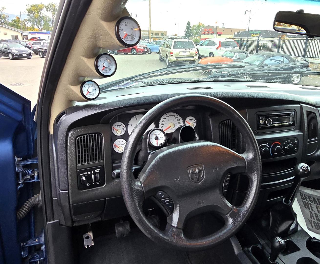 2003 Blue /Black Dodge Ram 2500 Laramie Quad Cab Long Bed 4WD (3D7KU28C13G) with an 5.9L L6 OHV 24V TURBO DIESEL engine, 6 Speed Manual transmission, located at 450 N Russell, Missoula, MT, 59801, (406) 543-6600, 46.874496, -114.017433 - Very Nice 5.9 Diesel 4WD Pickup. Hard to find 6 Speed Manual Transmission. Great Miles for it's age. Air Cruise. Tilt. Power Windows and Locks. Power Drivers Seat. Running Boards. Nice Tires and Wheels. Towing. Because of the age of this vehicle, financing is NOT available. - Photo#16