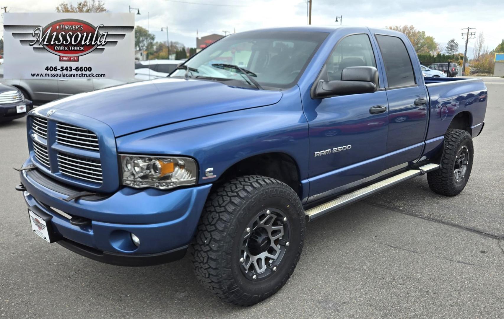 2003 Blue /Black Dodge Ram 2500 Laramie Quad Cab Long Bed 4WD (3D7KU28C13G) with an 5.9L L6 OHV 24V TURBO DIESEL engine, 6 Speed Manual transmission, located at 450 N Russell, Missoula, MT, 59801, (406) 543-6600, 46.874496, -114.017433 - Very Nice 5.9 Diesel 4WD Pickup. Hard to find 6 Speed Manual Transmission. Great Miles for it's age. Air Cruise. Tilt. Power Windows and Locks. Power Drivers Seat. Running Boards. Nice Tires and Wheels. Towing. Because of the age of this vehicle, financing is NOT available. - Photo#7