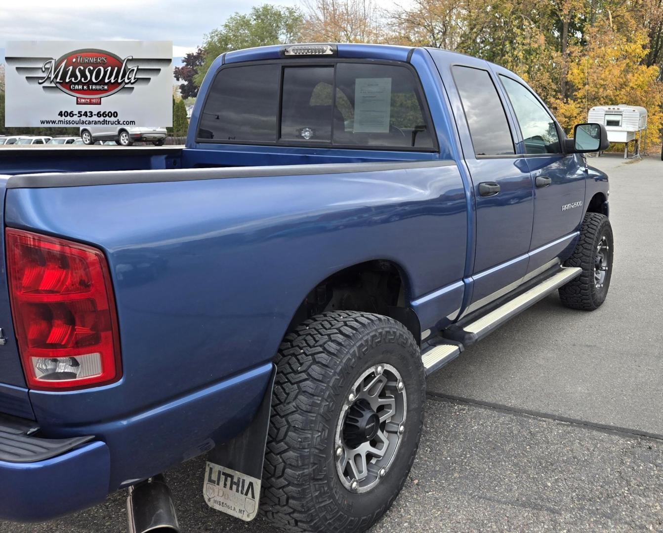 2003 Blue /Black Dodge Ram 2500 Laramie Quad Cab Long Bed 4WD (3D7KU28C13G) with an 5.9L L6 OHV 24V TURBO DIESEL engine, 6 Speed Manual transmission, located at 450 N Russell, Missoula, MT, 59801, (406) 543-6600, 46.874496, -114.017433 - Very Nice 5.9 Diesel 4WD Pickup. Hard to find 6 Speed Manual Transmission. Great Miles for it's age. Air Cruise. Tilt. Power Windows and Locks. Power Drivers Seat. Running Boards. Nice Tires and Wheels. Towing. Because of the age of this vehicle, financing is NOT available. - Photo#4
