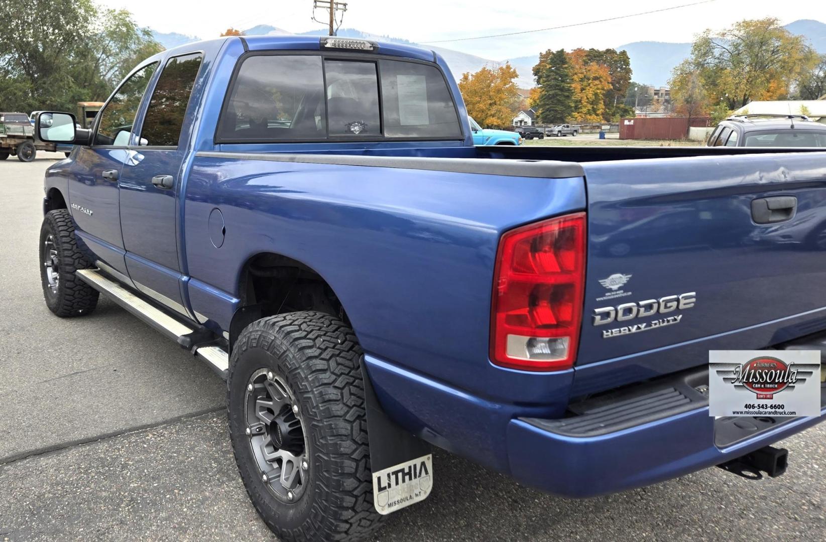 2003 Blue /Black Dodge Ram 2500 Laramie Quad Cab Long Bed 4WD (3D7KU28C13G) with an 5.9L L6 OHV 24V TURBO DIESEL engine, 6 Speed Manual transmission, located at 450 N Russell, Missoula, MT, 59801, (406) 543-6600, 46.874496, -114.017433 - Very Nice 5.9 Diesel 4WD Pickup. Hard to find 6 Speed Manual Transmission. Great Miles for it's age. Air Cruise. Tilt. Power Windows and Locks. Power Drivers Seat. Running Boards. Nice Tires and Wheels. Towing. Because of the age of this vehicle, financing is NOT available. - Photo#5