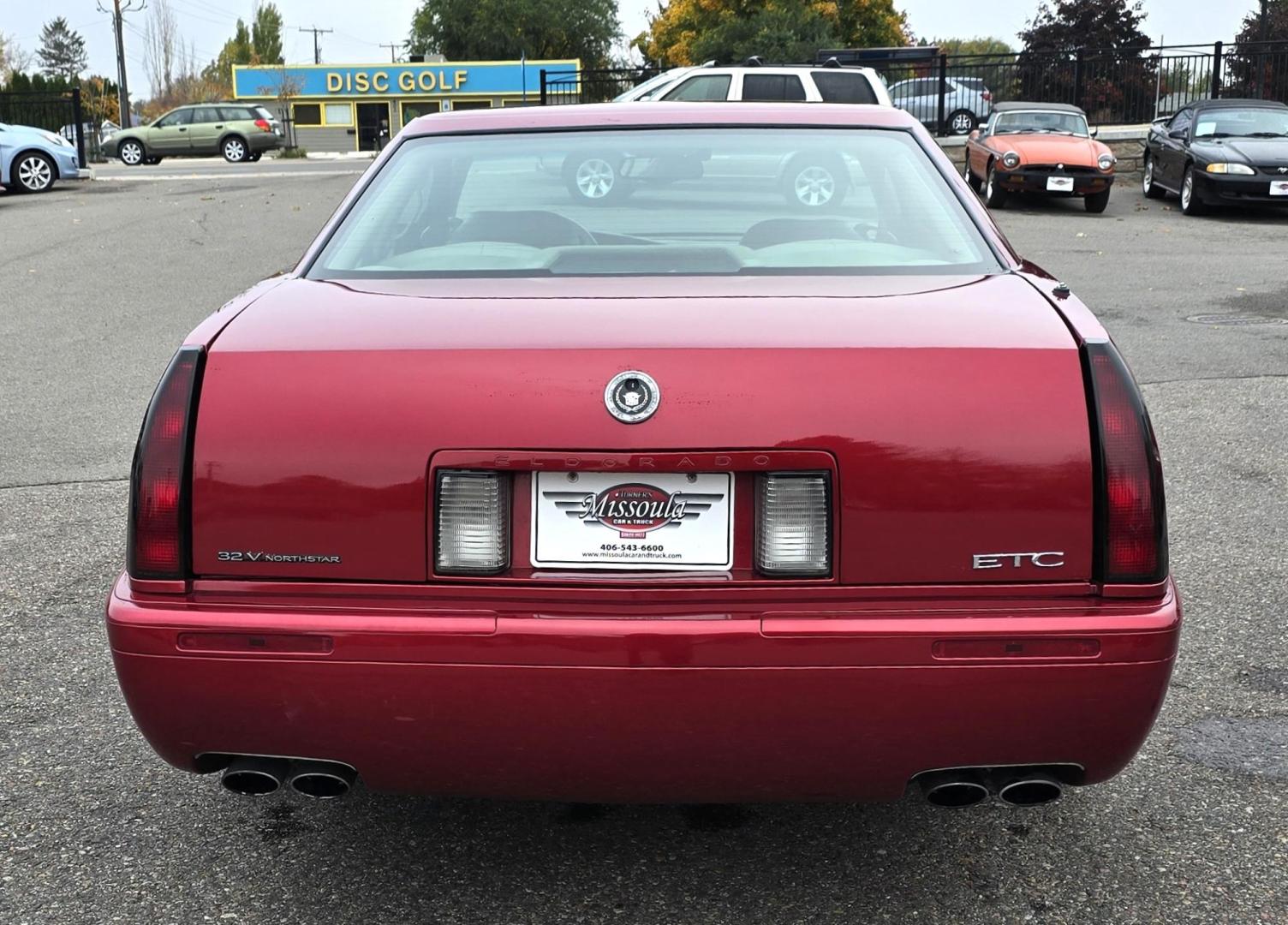 1999 Red /Black Cadillac Eldorado Touring Coupe (1G6ET129XXU) with an 4.6L V8 DOHC 32V engine, 4-Speed Automatic Overdrive transmission, located at 450 N Russell, Missoula, MT, 59801, (406) 543-6600, 46.874496, -114.017433 - Photo#5