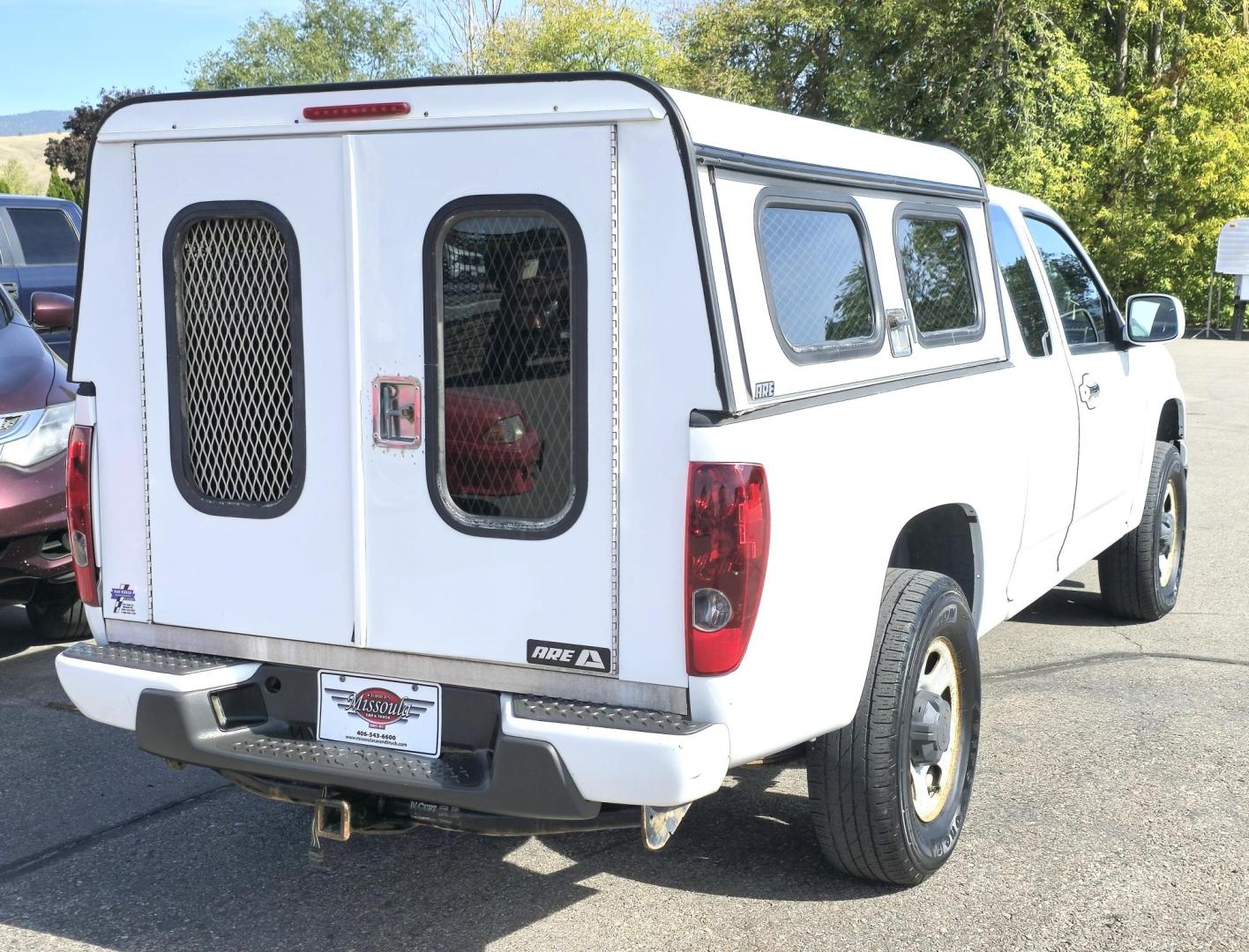 2012 White /Black Chevrolet Colorado Work Truck Ext. Cab 4WD (1GCJTBF95C8) with an 2.9L L4 DOHC 16V engine, Automatic transmission, located at 450 N Russell, Missoula, MT, 59801, (406) 543-6600, 46.874496, -114.017433 - Hard to find Colorado 4WD. 2.9L I4 Engine. New Timing Chain. Automatic. Former Animal Control Truck so it has a really nice Topper. Air Conditioning. Power Windows and Locks. Cruise Control. AM FM CD. - Photo#8