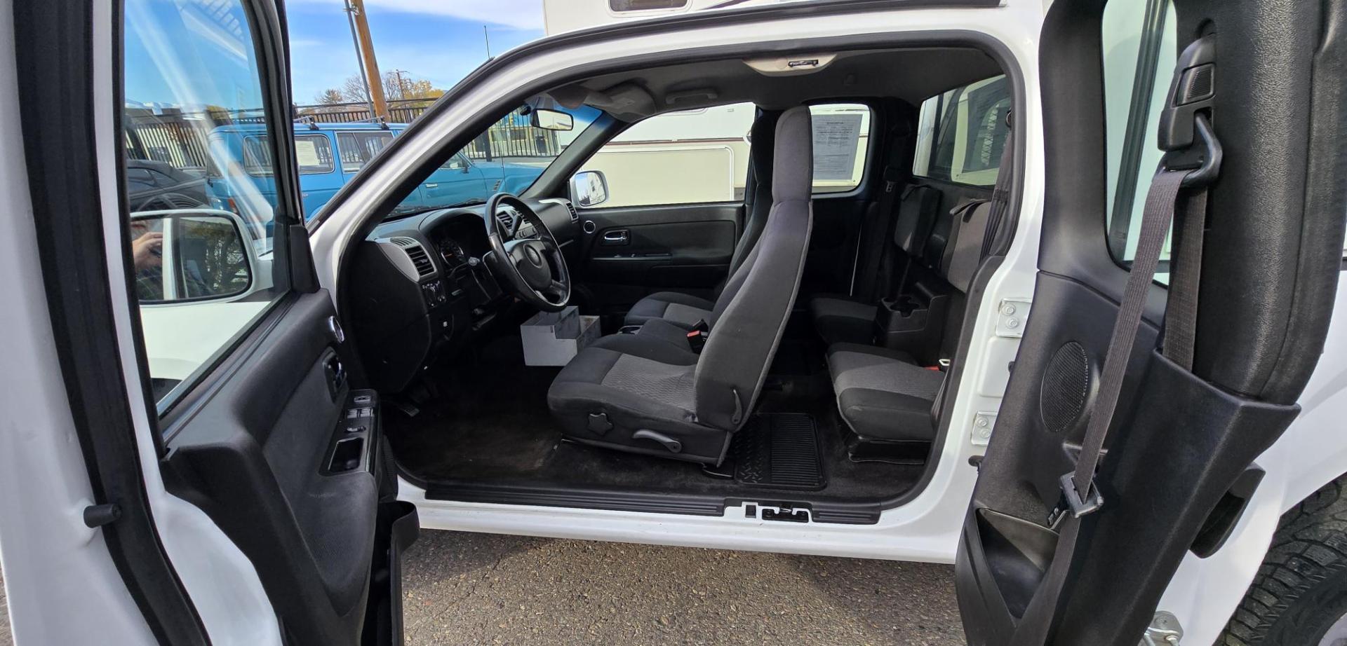 2009 White /Black Chevrolet Colorado Work Truck Ext. Cab 4WD (1GCDT19E998) with an 3.7L L5 DOHC 20V engine, Automatic transmission, located at 450 N Russell, Missoula, MT, 59801, (406) 543-6600, 46.874496, -114.017433 - 1 Owner. Clean Carfax. Former Missoula Animal Control Truck with Nice Topper. 4WD. 3.7L I5 Engine. Automatic Transmission. Air Conditioning. Cruise Control. Power Windows and Locks. Comes with Original Tailgate in case you want to take the topper off. - Photo#12