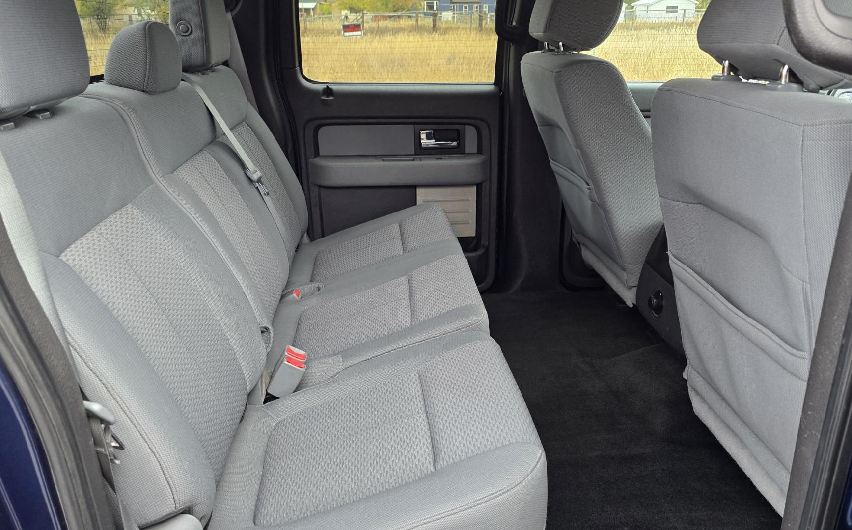 2013 Blue /Black Ford F-150 XLT SuperCrew 6.5-ft. Bed 4WD (1FTFW1EF1DK) with an 5.0L V8 engine, 6-Speed Automatic transmission, located at 450 N Russell, Missoula, MT, 59801, (406) 543-6600, 46.874496, -114.017433 - Don't let the miles scare you. This truck runs amazing. 4WD. 5.0 V8 Engine. Automatic Transmission. Air. Cruise. Tilt. Power Windows and Locks. Backup Camera. AM FM XM. Bluetooth for Audio and Phone. Nice custom Wheels. Tonneau Cover. Clean Carfax and Title. Financing is NOT Available on this V - Photo#10