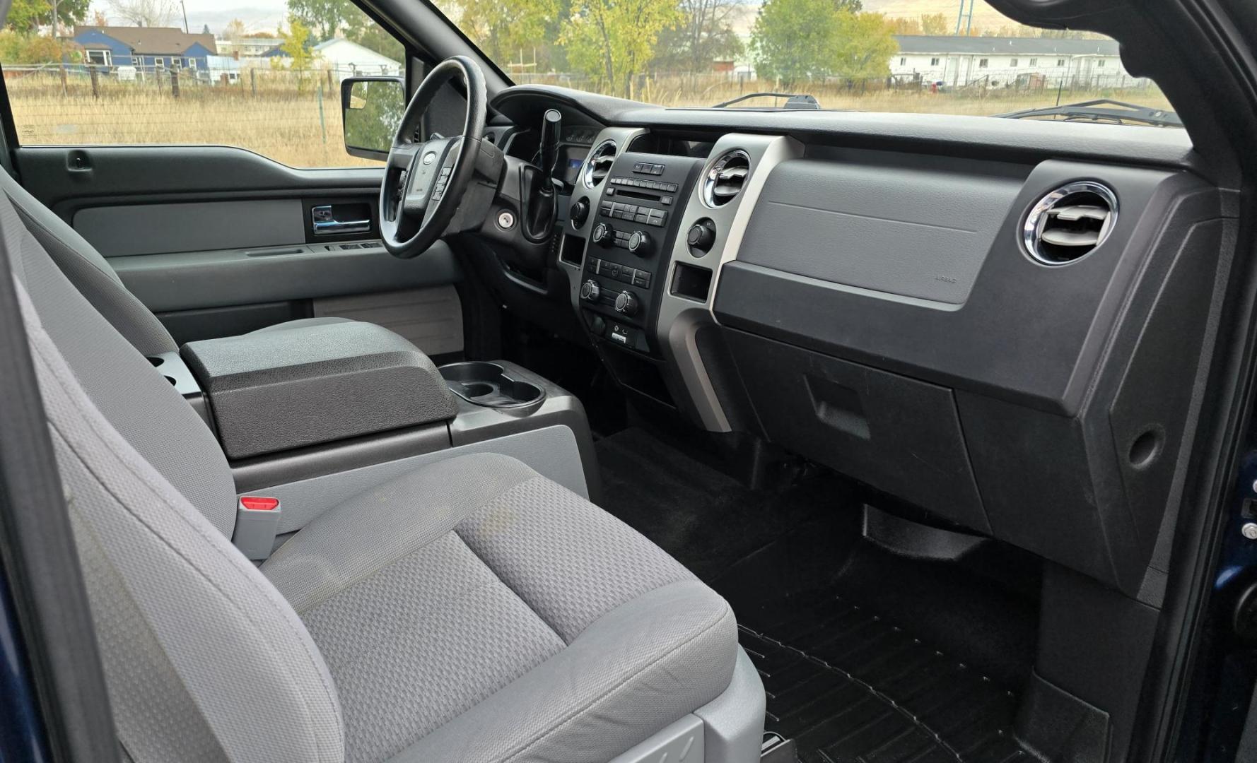 2013 Blue /Black Ford F-150 XLT SuperCrew 6.5-ft. Bed 4WD (1FTFW1EF1DK) with an 5.0L V8 engine, 6-Speed Automatic transmission, located at 450 N Russell, Missoula, MT, 59801, (406) 543-6600, 46.874496, -114.017433 - Don't let the miles scare you. This truck runs amazing. 4WD. 5.0 V8 Engine. Automatic Transmission. Air. Cruise. Tilt. Power Windows and Locks. Backup Camera. AM FM XM. Bluetooth for Audio and Phone. Nice custom Wheels. Tonneau Cover. Clean Carfax and Title. Financing is NOT Available on this V - Photo#11