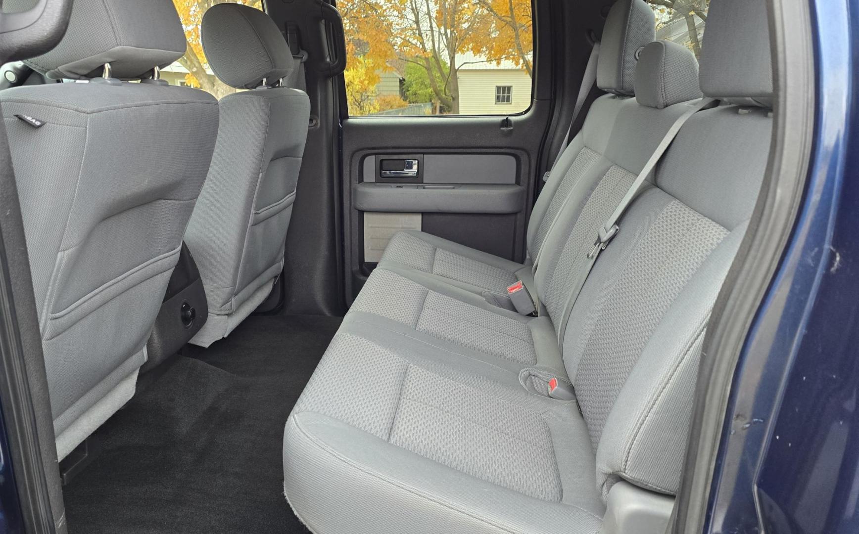 2013 Blue /Black Ford F-150 XLT SuperCrew 6.5-ft. Bed 4WD (1FTFW1EF1DK) with an 5.0L V8 engine, 6-Speed Automatic transmission, located at 450 N Russell, Missoula, MT, 59801, (406) 543-6600, 46.874496, -114.017433 - Don't let the miles scare you. This truck runs amazing. 4WD. 5.0 V8 Engine. Automatic Transmission. Air. Cruise. Tilt. Power Windows and Locks. Backup Camera. AM FM XM. Bluetooth for Audio and Phone. Nice custom Wheels. Tonneau Cover. Clean Carfax and Title. Financing is NOT Available on this V - Photo#13