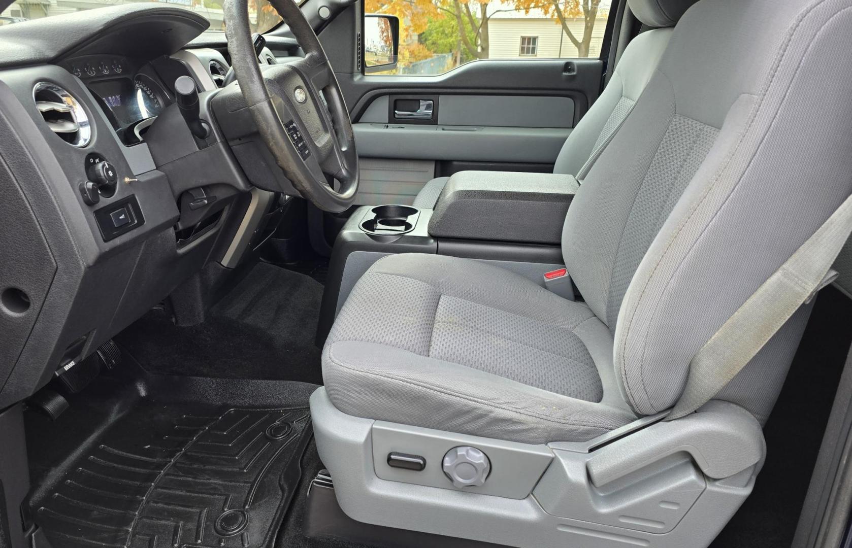 2013 Blue /Black Ford F-150 XLT SuperCrew 6.5-ft. Bed 4WD (1FTFW1EF1DK) with an 5.0L V8 engine, 6-Speed Automatic transmission, located at 450 N Russell, Missoula, MT, 59801, (406) 543-6600, 46.874496, -114.017433 - Don't let the miles scare you. This truck runs amazing. 4WD. 5.0 V8 Engine. Automatic Transmission. Air. Cruise. Tilt. Power Windows and Locks. Backup Camera. AM FM XM. Bluetooth for Audio and Phone. Nice custom Wheels. Tonneau Cover. Clean Carfax and Title. Financing is NOT Available on this V - Photo#16
