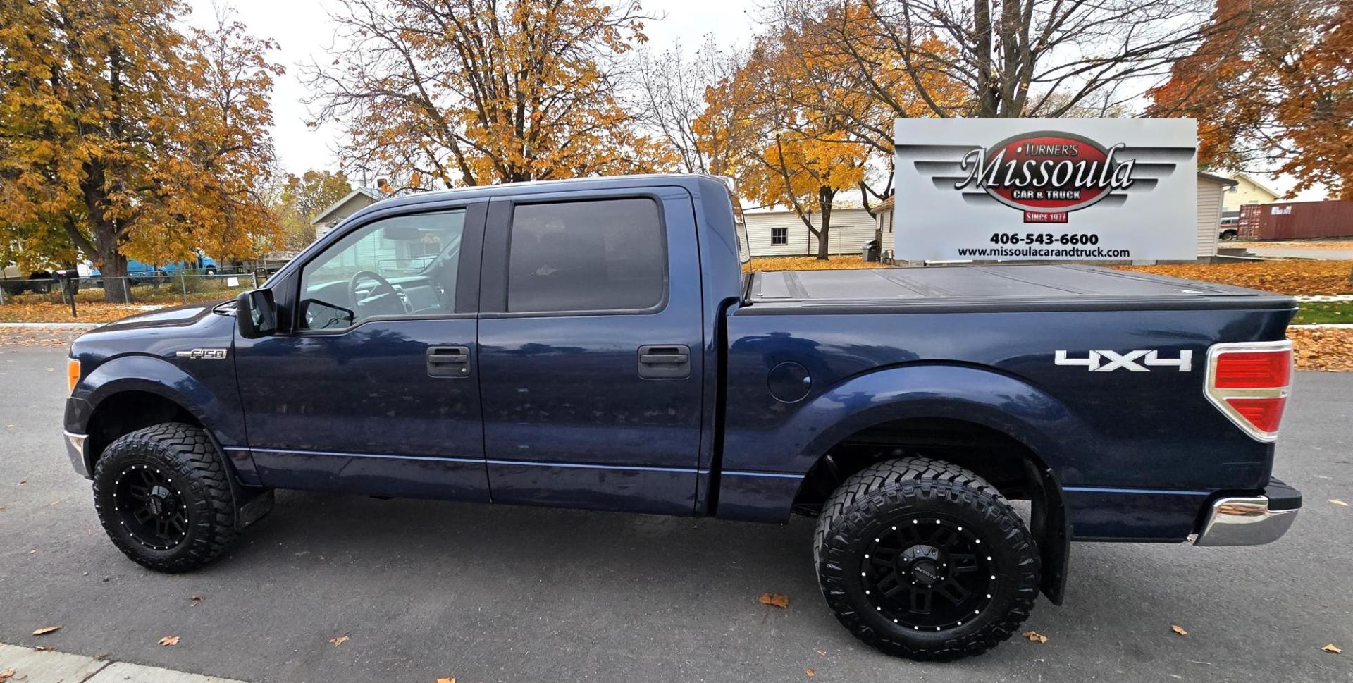 2013 Blue /Black Ford F-150 XLT SuperCrew 6.5-ft. Bed 4WD (1FTFW1EF1DK) with an 5.0L V8 engine, 6-Speed Automatic transmission, located at 450 N Russell, Missoula, MT, 59801, (406) 543-6600, 46.874496, -114.017433 - Don't let the miles scare you. This truck runs amazing. 4WD. 5.0 V8 Engine. Automatic Transmission. Air. Cruise. Tilt. Power Windows and Locks. Backup Camera. AM FM XM. Bluetooth for Audio and Phone. Nice custom Wheels. Tonneau Cover. Clean Carfax and Title. Financing is NOT Available on this V - Photo#2