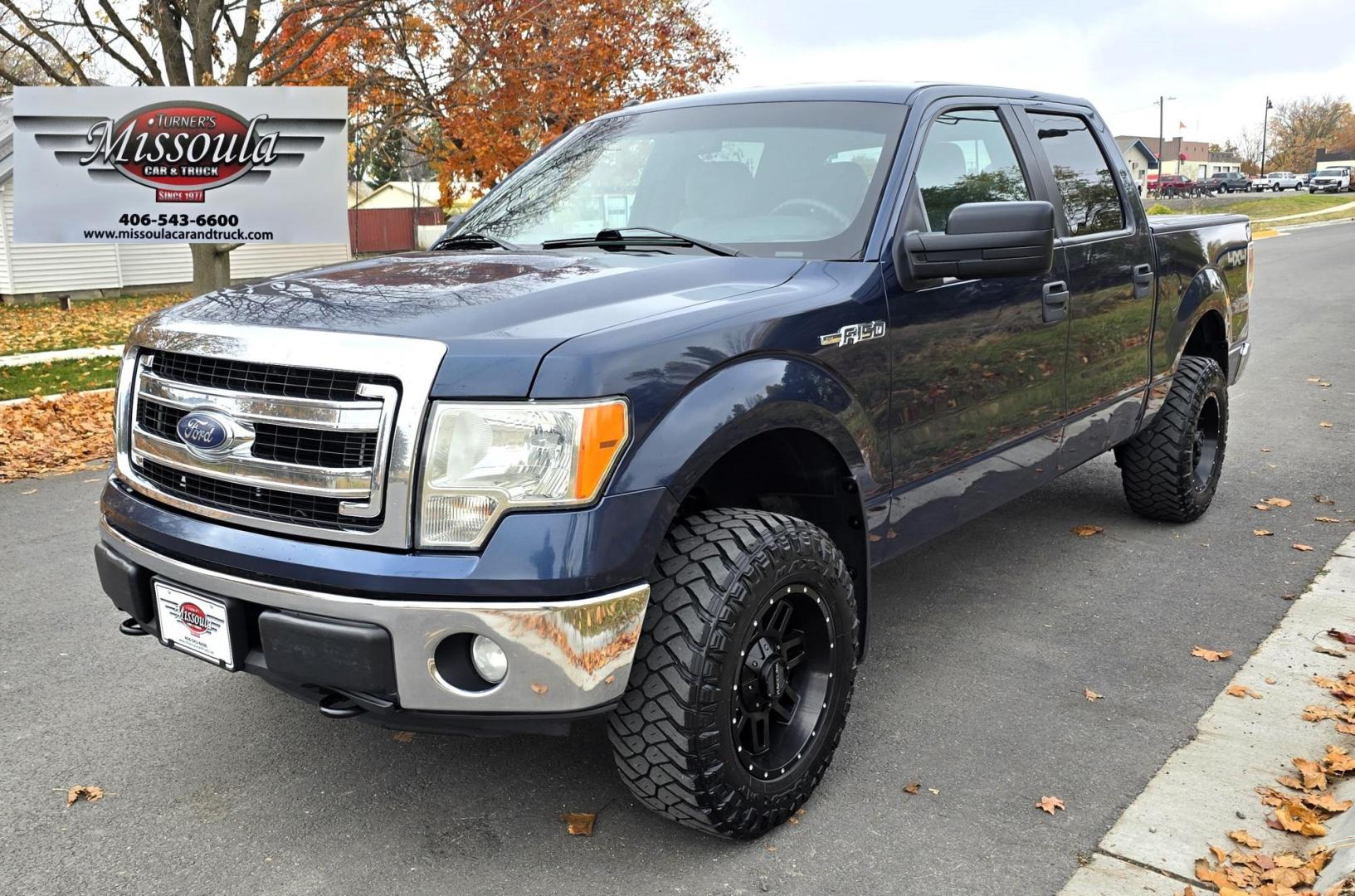 2013 Blue /Black Ford F-150 XLT SuperCrew 6.5-ft. Bed 4WD (1FTFW1EF1DK) with an 5.0L V8 engine, 6-Speed Automatic transmission, located at 450 N Russell, Missoula, MT, 59801, (406) 543-6600, 46.874496, -114.017433 - Don't let the miles scare you. This truck runs amazing. 4WD. 5.0 V8 Engine. Automatic Transmission. Air. Cruise. Tilt. Power Windows and Locks. Backup Camera. AM FM XM. Bluetooth for Audio and Phone. Nice custom Wheels. Tonneau Cover. Clean Carfax and Title. Financing is NOT Available on this V - Photo#4