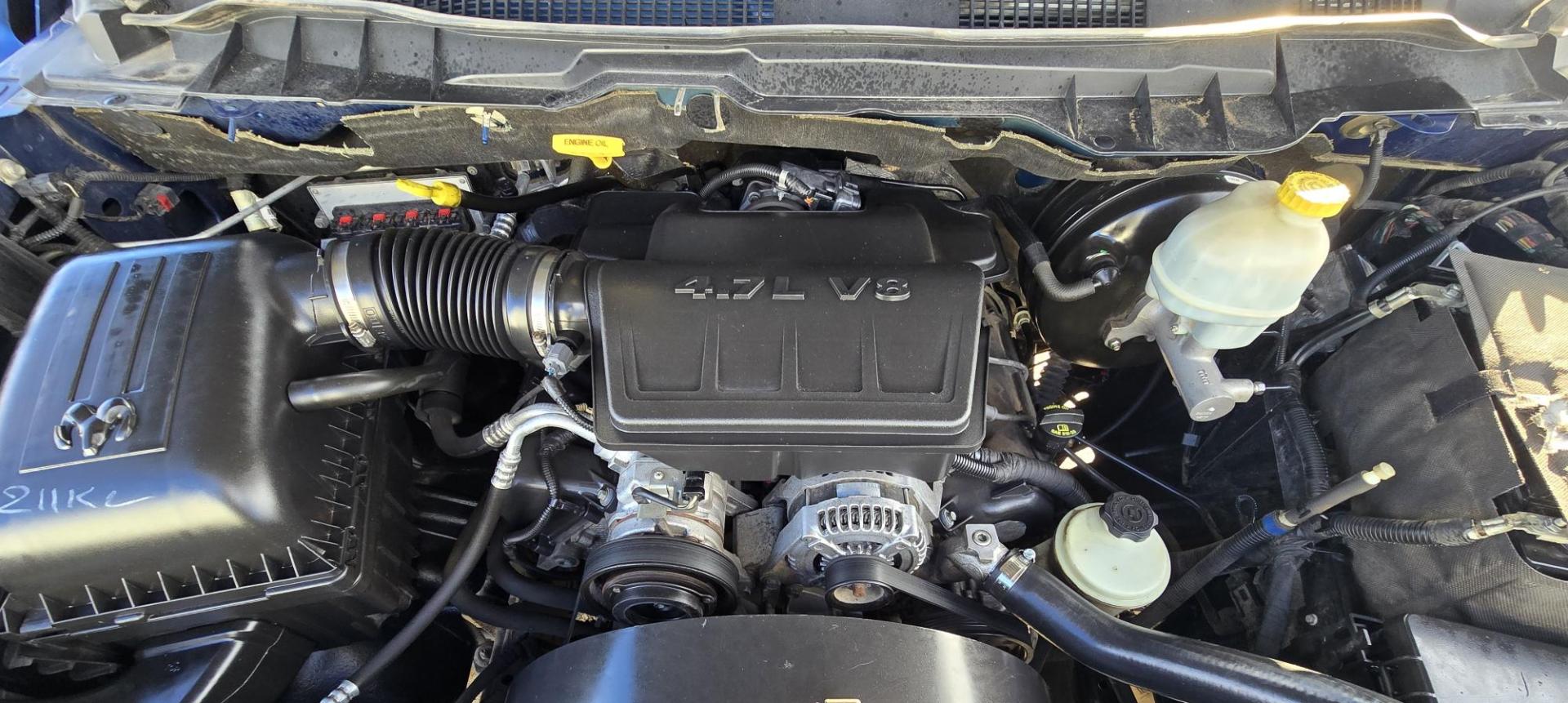 2010 Blue /Black Dodge Ram 1500 Laramie Quad Cab 4WD (1D7RV1GP2AS) with an 4.7L V8 SOHC 16V FFV engine, 5-Speed Automatic transmission, located at 450 N Russell, Missoula, MT, 59801, (406) 543-6600, 46.874496, -114.017433 - Don't let the miles scare you. This Truck runs amazing!! 4 Wheel Drive. Automatic Transmission. 4.7L V8 Engine. Nice matching topper. Air. Cruise. Tilt. Power Windows and Locks. Towing. Because of the miles, Financing is NOT Available. - Photo#14