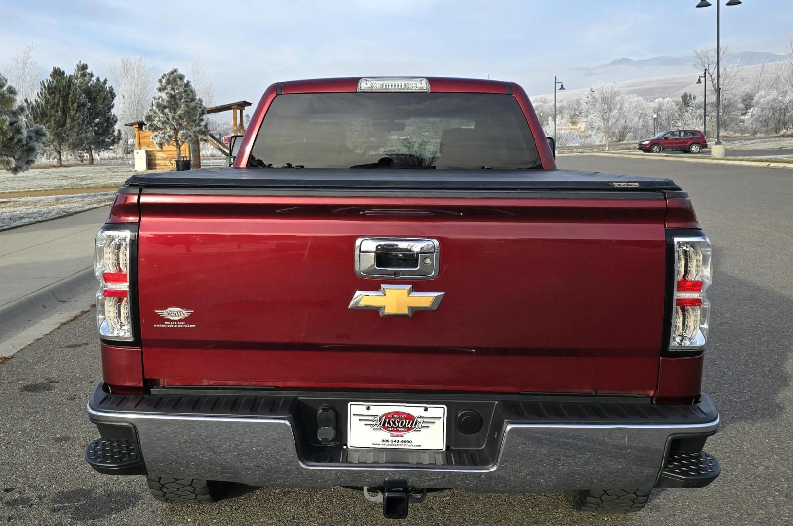 2016 Maroon /Black Chevrolet Silverado 1500 LT Crew Cab 4WD (3GCUKREC2GG) with an 5.3L V8 OHV 16V engine, 6A transmission, located at 450 N Russell, Missoula, MT, 59801, (406) 543-6600, 46.874496, -114.017433 - Great looking 4WD Chevy. 5.3L V8. Automatic. Air. Cruise. Tilt. Bluetooth Audio and Phone. OnStar Navigation. Power Windows and Locks. Remote Started. Heated Seats. Nice custom wheels. - Photo#6