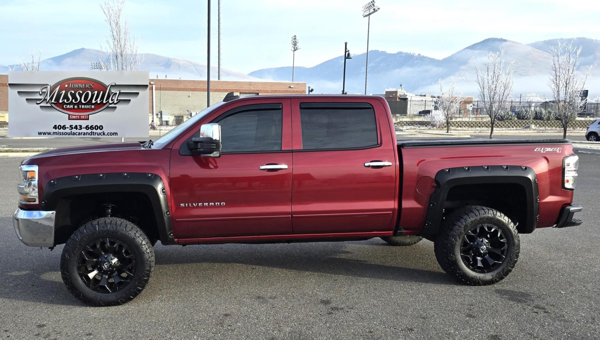 2016 Maroon /Black Chevrolet Silverado 1500 LT Crew Cab 4WD (3GCUKREC2GG) with an 5.3L V8 OHV 16V engine, 6A transmission, located at 450 N Russell, Missoula, MT, 59801, (406) 543-6600, 46.874496, -114.017433 - Great looking 4WD Chevy. 5.3L V8. Automatic. Air. Cruise. Tilt. Bluetooth Audio and Phone. OnStar Navigation. Power Windows and Locks. Remote Started. Heated Seats. Nice custom wheels. - Photo#5