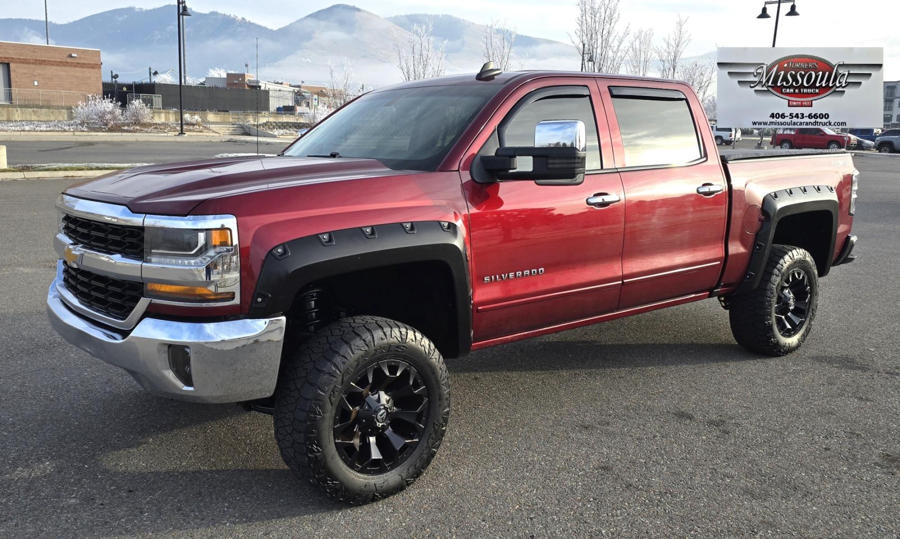 2016 Maroon /Black Chevrolet Silverado 1500 LT Crew Cab 4WD (3GCUKREC2GG) with an 5.3L V8 OHV 16V engine, 6A transmission, located at 450 N Russell, Missoula, MT, 59801, (406) 543-6600, 46.874496, -114.017433 - Great looking 4WD Chevy. 5.3L V8. Automatic. Air. Cruise. Tilt. Bluetooth Audio and Phone. OnStar Navigation. Power Windows and Locks. Remote Started. Heated Seats. Nice custom wheels. - Photo#2