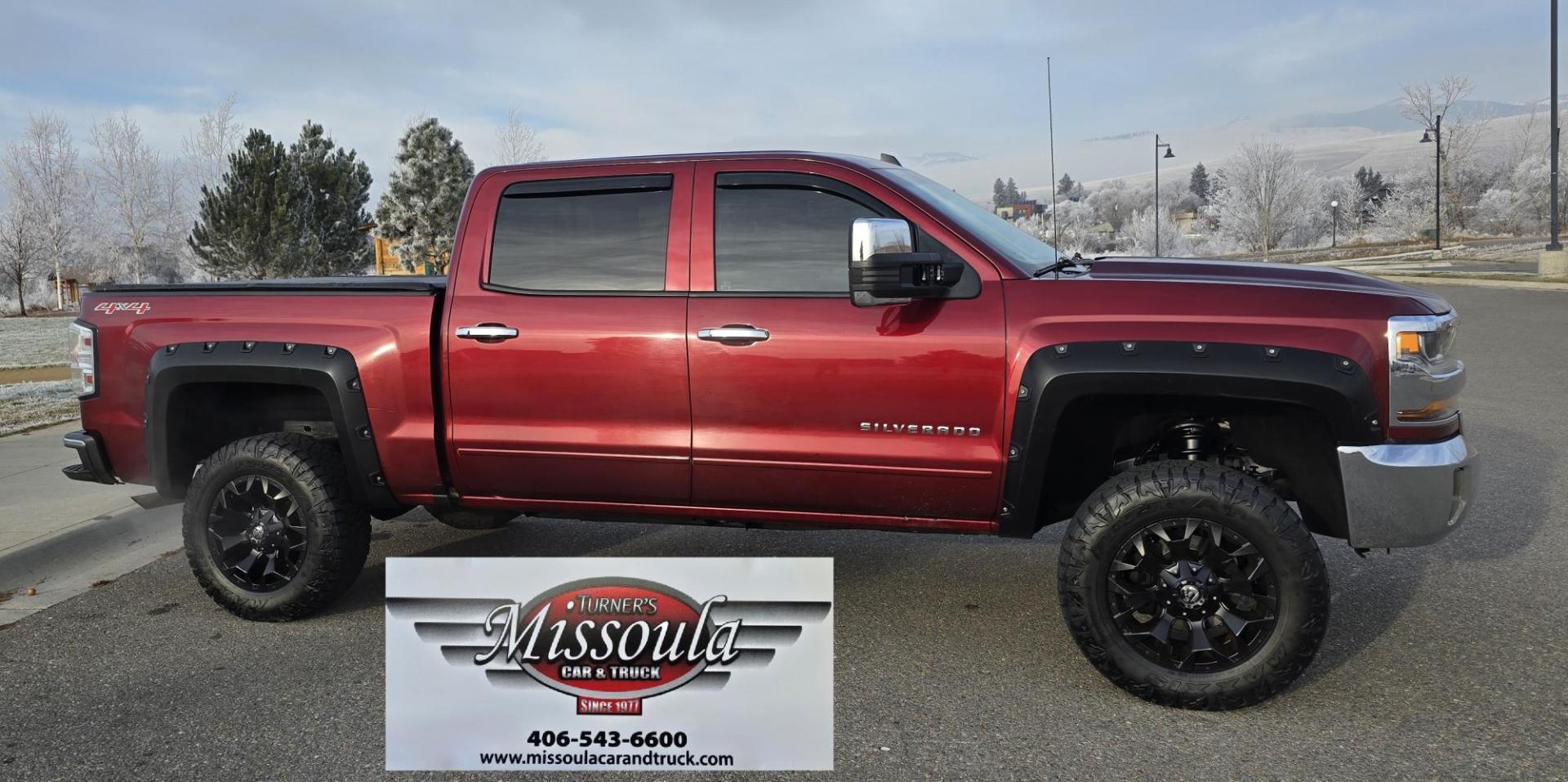 2016 Maroon /Black Chevrolet Silverado 1500 LT Crew Cab 4WD (3GCUKREC2GG) with an 5.3L V8 OHV 16V engine, 6A transmission, located at 450 N Russell, Missoula, MT, 59801, (406) 543-6600, 46.874496, -114.017433 - Great looking 4WD Chevy. 5.3L V8. Automatic. Air. Cruise. Tilt. Bluetooth Audio and Phone. OnStar Navigation. Power Windows and Locks. Remote Started. Heated Seats. Nice custom wheels. - Photo#4