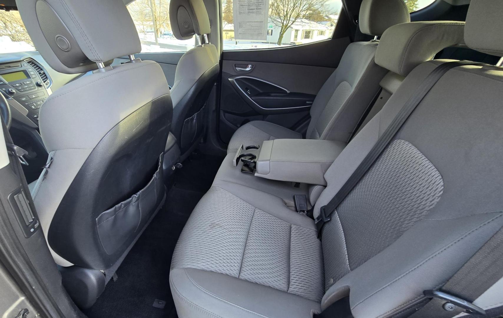 2014 Mineral Gray /Gray Hyundai Santa Fe Sport 2.4 AWD (5XYZTDLB5EG) with an 2.4L L4 DOHC 16V engine, 6-Speed Automatic transmission, located at 450 N Russell, Missoula, MT, 59801, (406) 543-6600, 46.874496, -114.017433 - Great Running FWD SUV Not all wheel drive. 2.4L I4 Engine. Automatic Transmission. Air. Cruise. Tilt. Power Windows and Locks. AM FM CD Player. Bluetooth Audio and Phone. Towing. Has a fair size scratch on the front left fender. - Photo#10