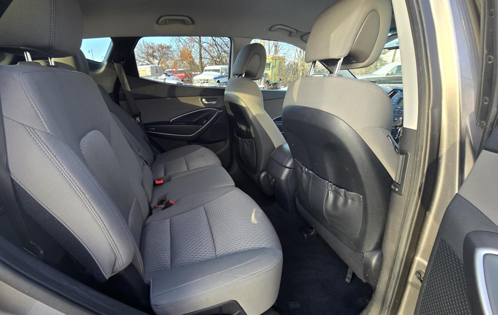 2014 Mineral Gray /Gray Hyundai Santa Fe Sport 2.4 AWD (5XYZTDLB5EG) with an 2.4L L4 DOHC 16V engine, 6-Speed Automatic transmission, located at 450 N Russell, Missoula, MT, 59801, (406) 543-6600, 46.874496, -114.017433 - Great Running FWD SUV Not all wheel drive. 2.4L I4 Engine. Automatic Transmission. Air. Cruise. Tilt. Power Windows and Locks. AM FM CD Player. Bluetooth Audio and Phone. Towing. Has a fair size scratch on the front left fender. - Photo#11