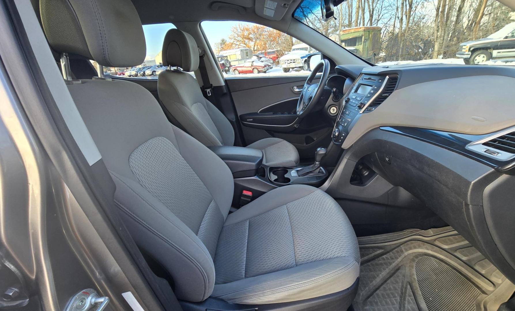 2014 Mineral Gray /Gray Hyundai Santa Fe Sport 2.4 AWD (5XYZTDLB5EG) with an 2.4L L4 DOHC 16V engine, 6-Speed Automatic transmission, located at 450 N Russell, Missoula, MT, 59801, (406) 543-6600, 46.874496, -114.017433 - Great Running FWD SUV Not all wheel drive. 2.4L I4 Engine. Automatic Transmission. Air. Cruise. Tilt. Power Windows and Locks. AM FM CD Player. Bluetooth Audio and Phone. Towing. Has a fair size scratch on the front left fender. - Photo#12