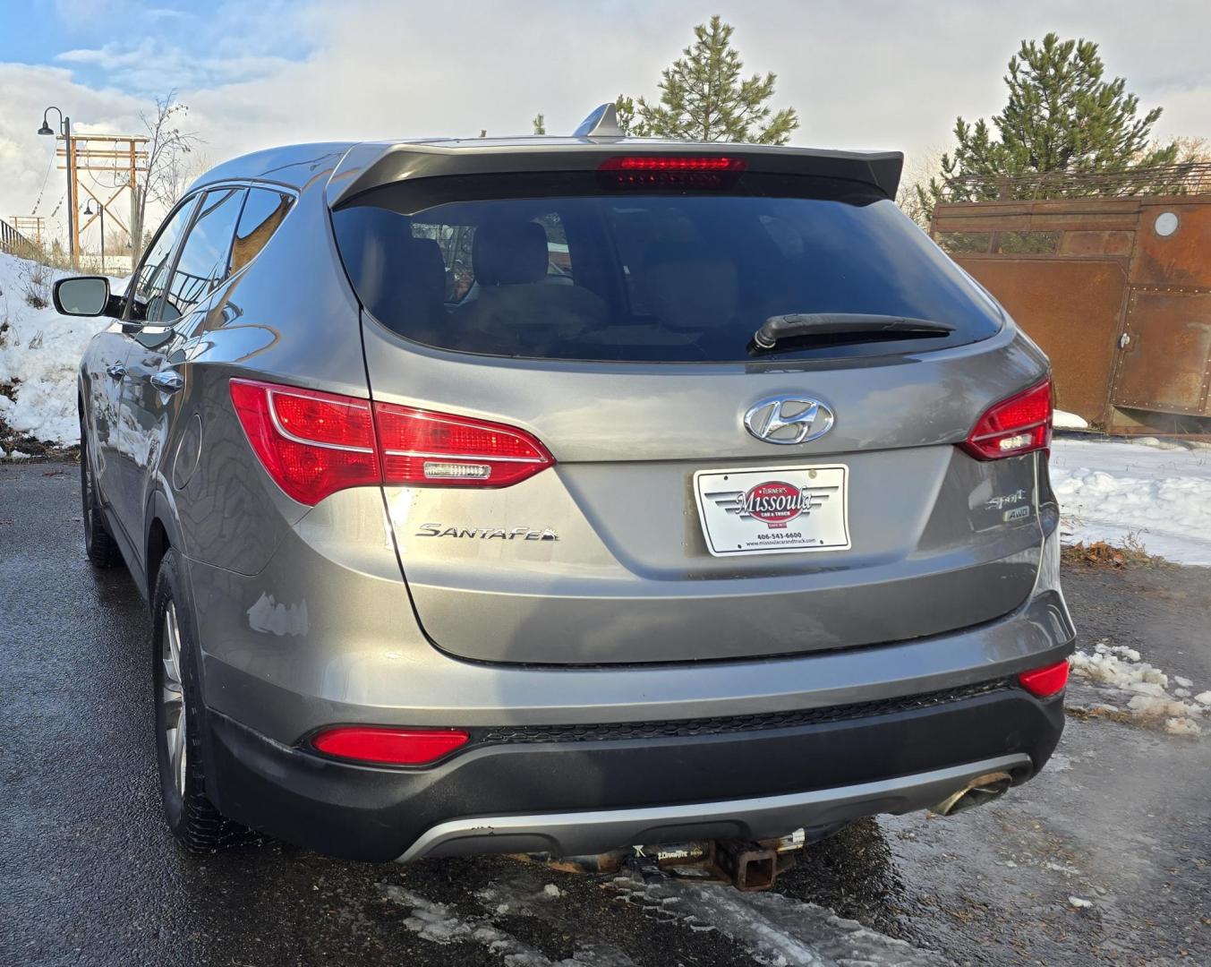 2014 Mineral Gray /Gray Hyundai Santa Fe Sport 2.4 AWD (5XYZTDLB5EG) with an 2.4L L4 DOHC 16V engine, 6-Speed Automatic transmission, located at 450 N Russell, Missoula, MT, 59801, (406) 543-6600, 46.874496, -114.017433 - Great Running FWD SUV Not all wheel drive. 2.4L I4 Engine. Automatic Transmission. Air. Cruise. Tilt. Power Windows and Locks. AM FM CD Player. Bluetooth Audio and Phone. Towing. Has a fair size scratch on the front left fender. - Photo#2