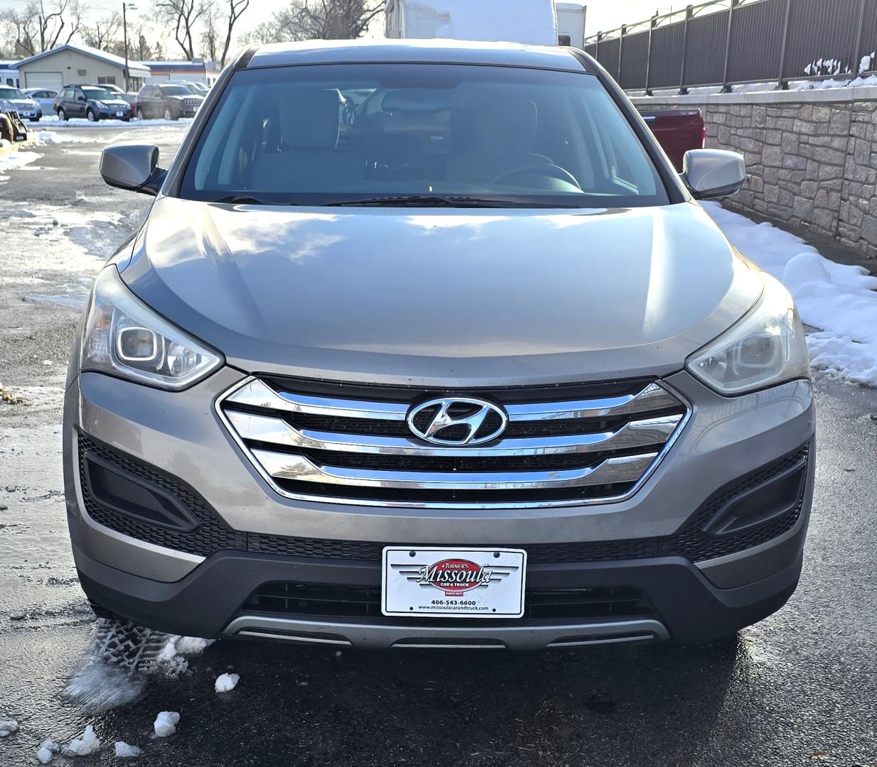 2014 Mineral Gray /Gray Hyundai Santa Fe Sport 2.4 AWD (5XYZTDLB5EG) with an 2.4L L4 DOHC 16V engine, 6-Speed Automatic transmission, located at 450 N Russell, Missoula, MT, 59801, (406) 543-6600, 46.874496, -114.017433 - Great Running FWD SUV Not all wheel drive. 2.4L I4 Engine. Automatic Transmission. Air. Cruise. Tilt. Power Windows and Locks. AM FM CD Player. Bluetooth Audio and Phone. Towing. Has a fair size scratch on the front left fender. - Photo#3