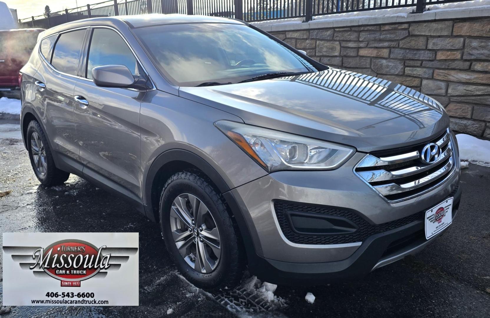 2014 Mineral Gray /Gray Hyundai Santa Fe Sport 2.4 AWD (5XYZTDLB5EG) with an 2.4L L4 DOHC 16V engine, 6-Speed Automatic transmission, located at 450 N Russell, Missoula, MT, 59801, (406) 543-6600, 46.874496, -114.017433 - Great Running FWD SUV Not all wheel drive. 2.4L I4 Engine. Automatic Transmission. Air. Cruise. Tilt. Power Windows and Locks. AM FM CD Player. Bluetooth Audio and Phone. Towing. Has a fair size scratch on the front left fender. - Photo#4